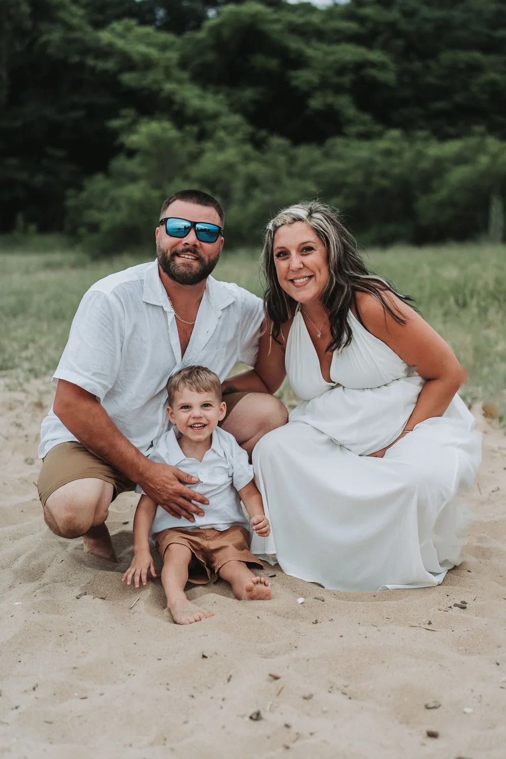 Family of three in white on location in Maryland