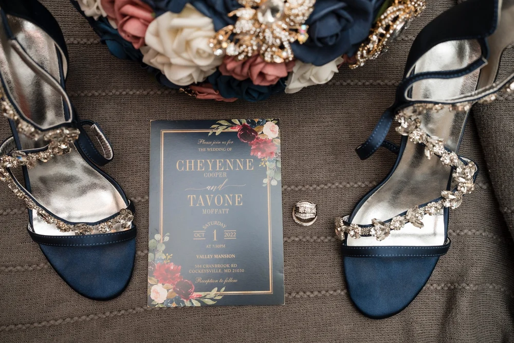 Groom's shoes and accessories laid out before the ceremony