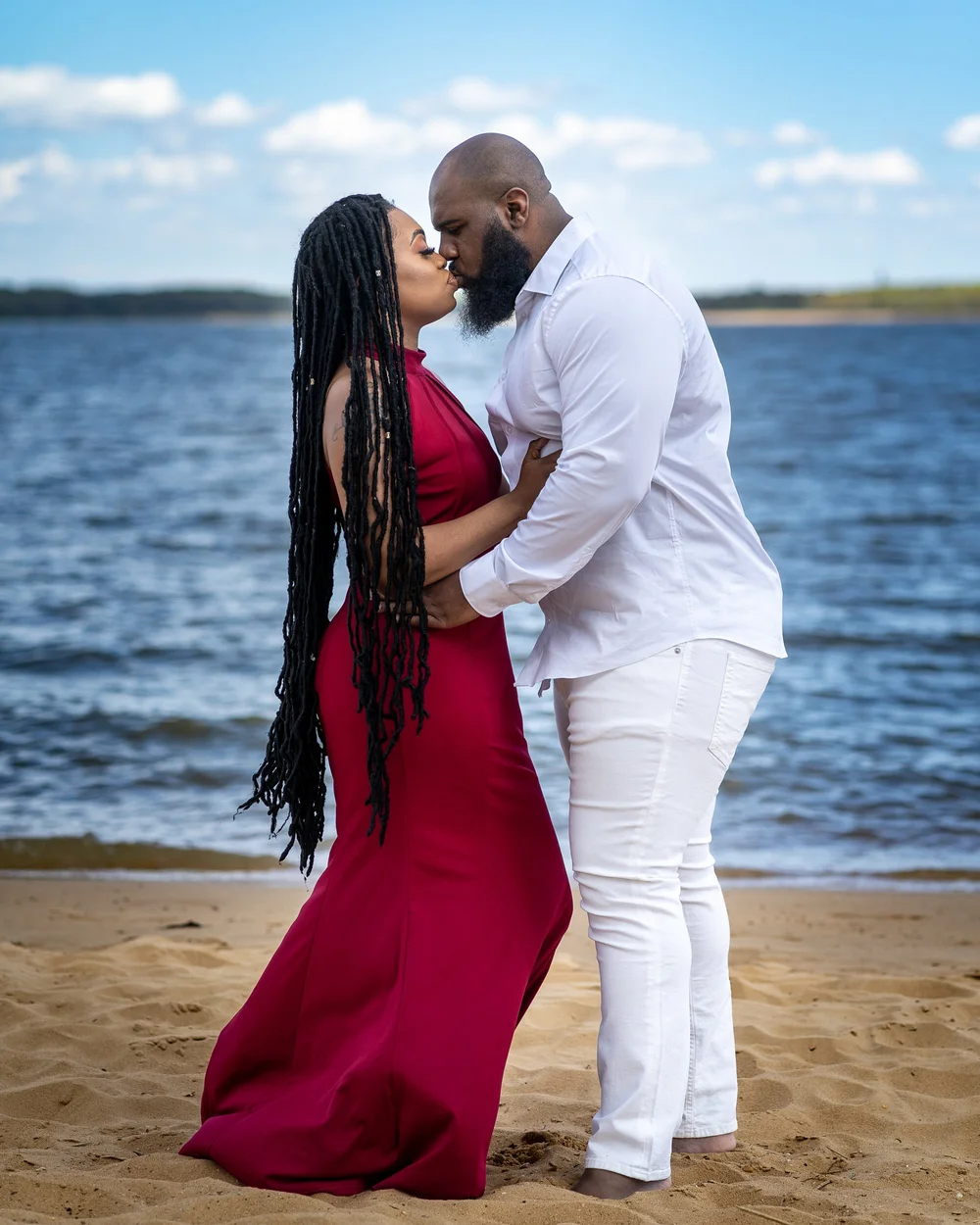 Couple in red and grey at a Maryland engagement session