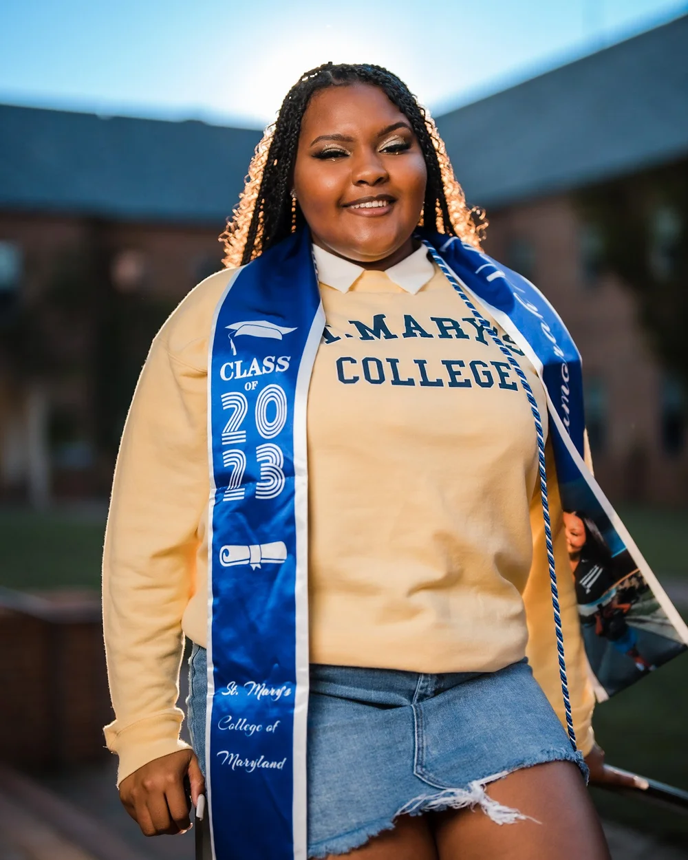 Graduate in a St. Mary's College sweatshirt