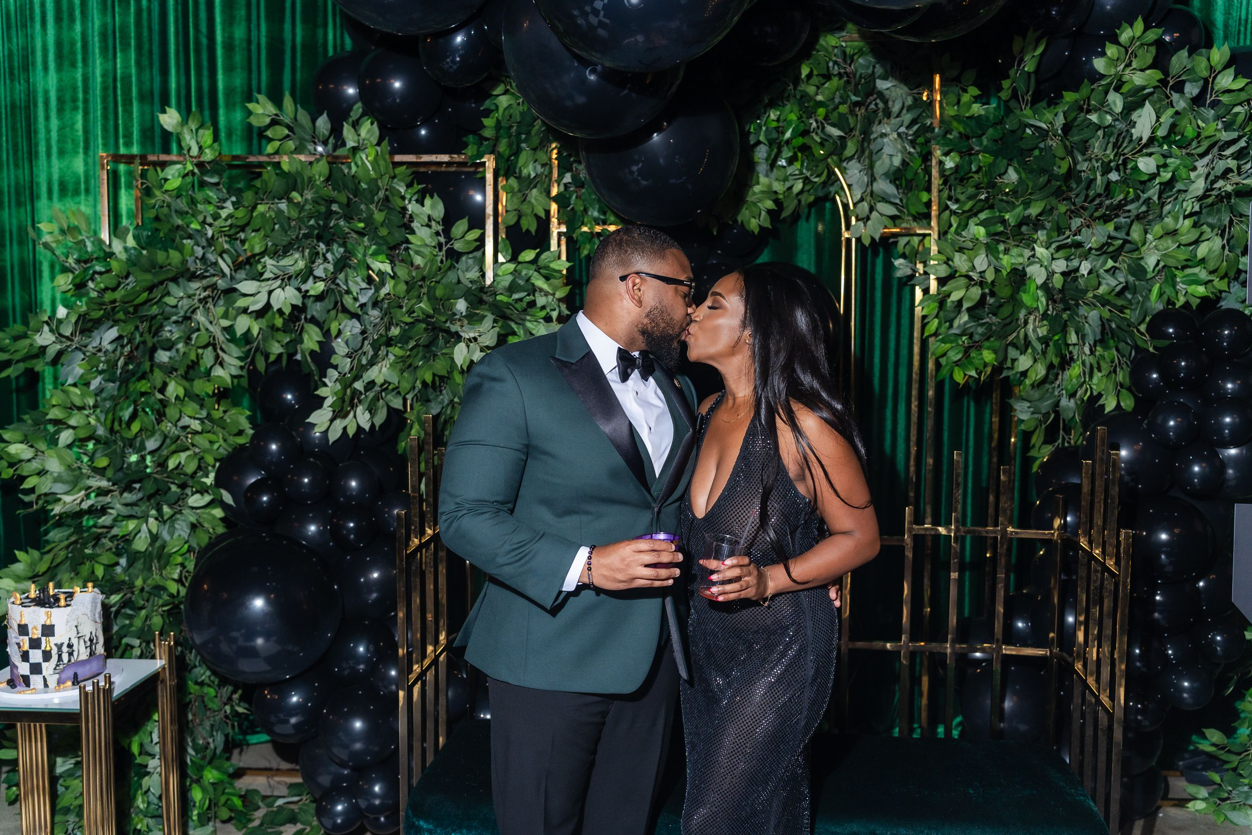 Guests embracing during a black-tie birthday celebration in Baltimore