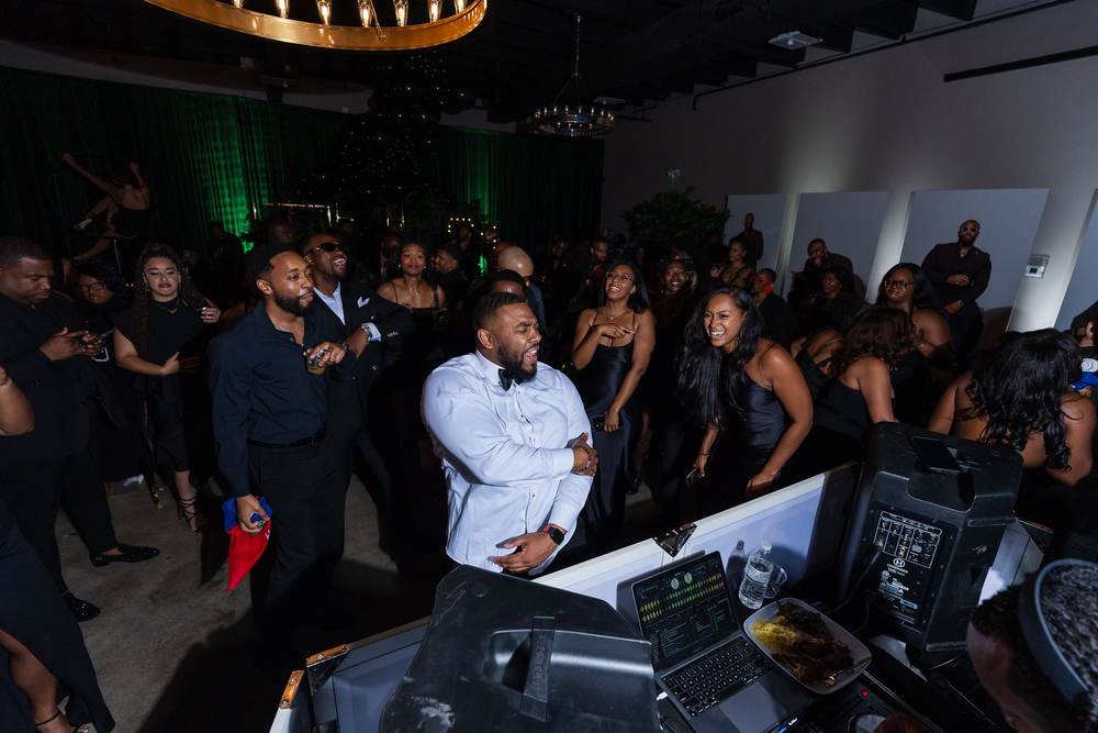 Guests dancing near the DJ booth at a Baltimore event