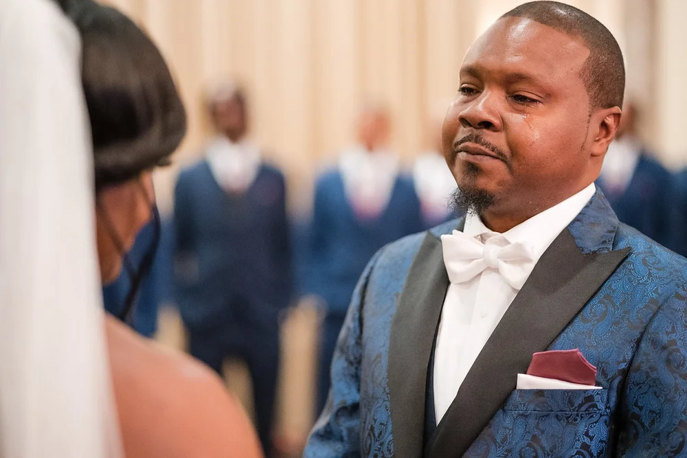 Groom waiting at the altar during a Baltimore wedding ceremony