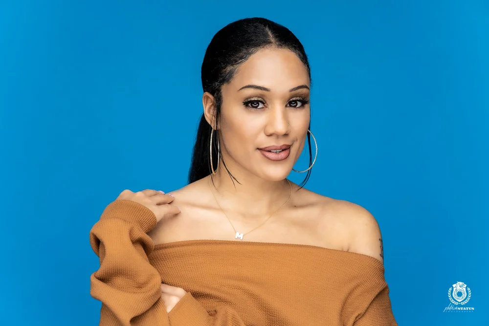 Studio portrait on a blue seamless backdrop