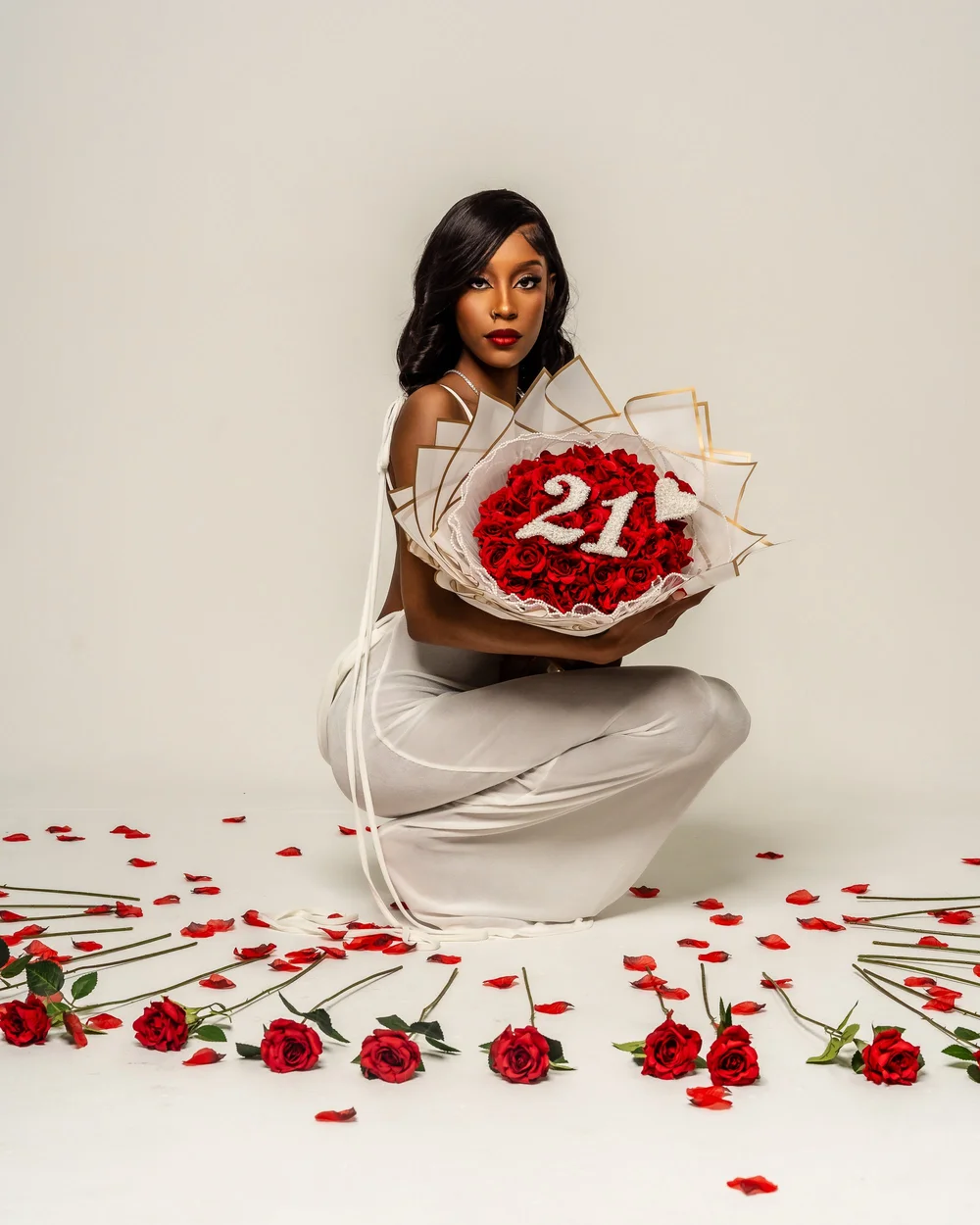 Studio portrait with a 21st birthday cake on a red backdrop, Baltimore photography studio