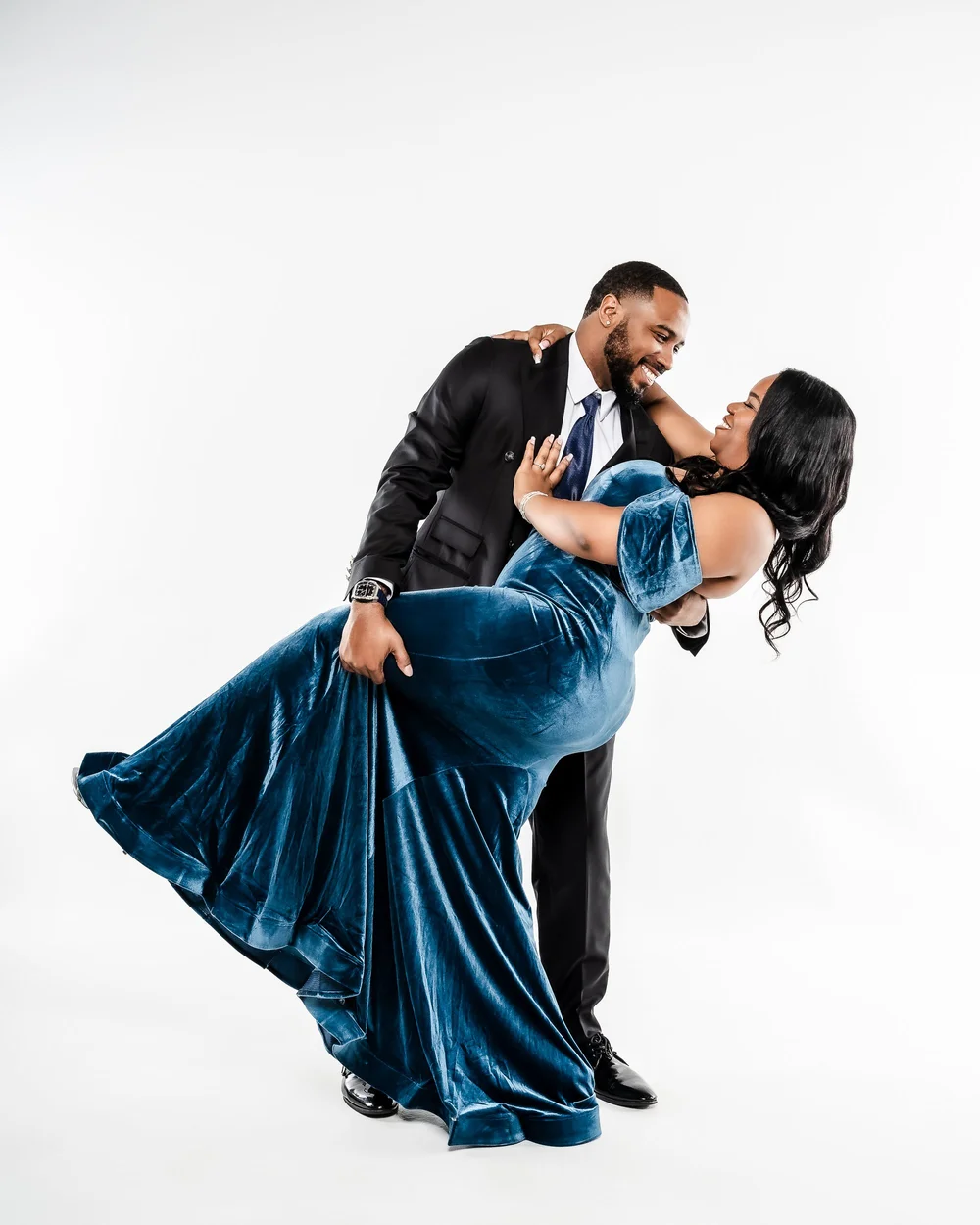 Engagement session portrait of a couple in blue