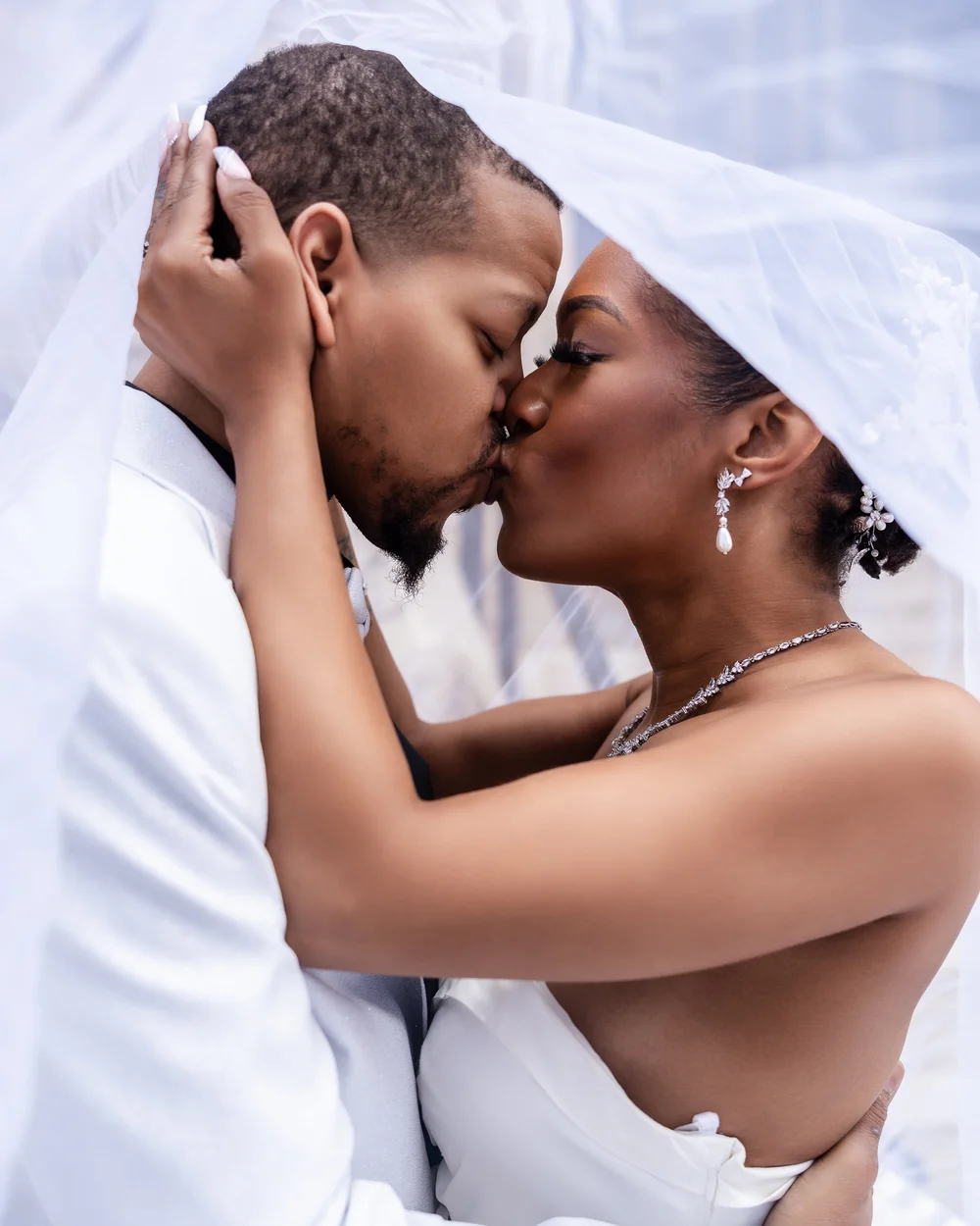 Close engagement portrait of a couple embracing
