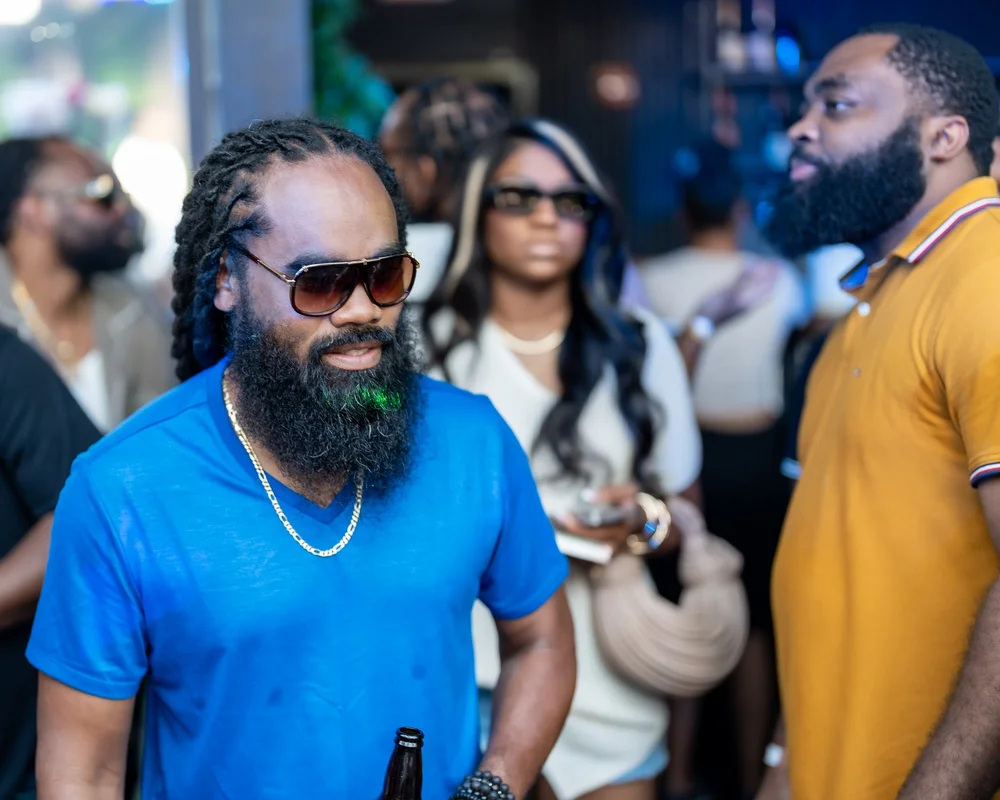 Guest in blue and sunglasses at a Baltimore summer party