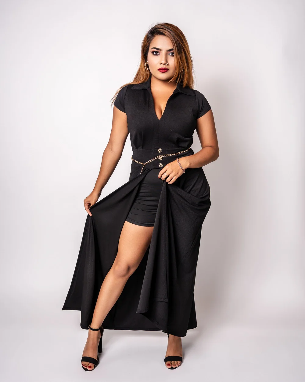 Studio portrait in a flowing black gown