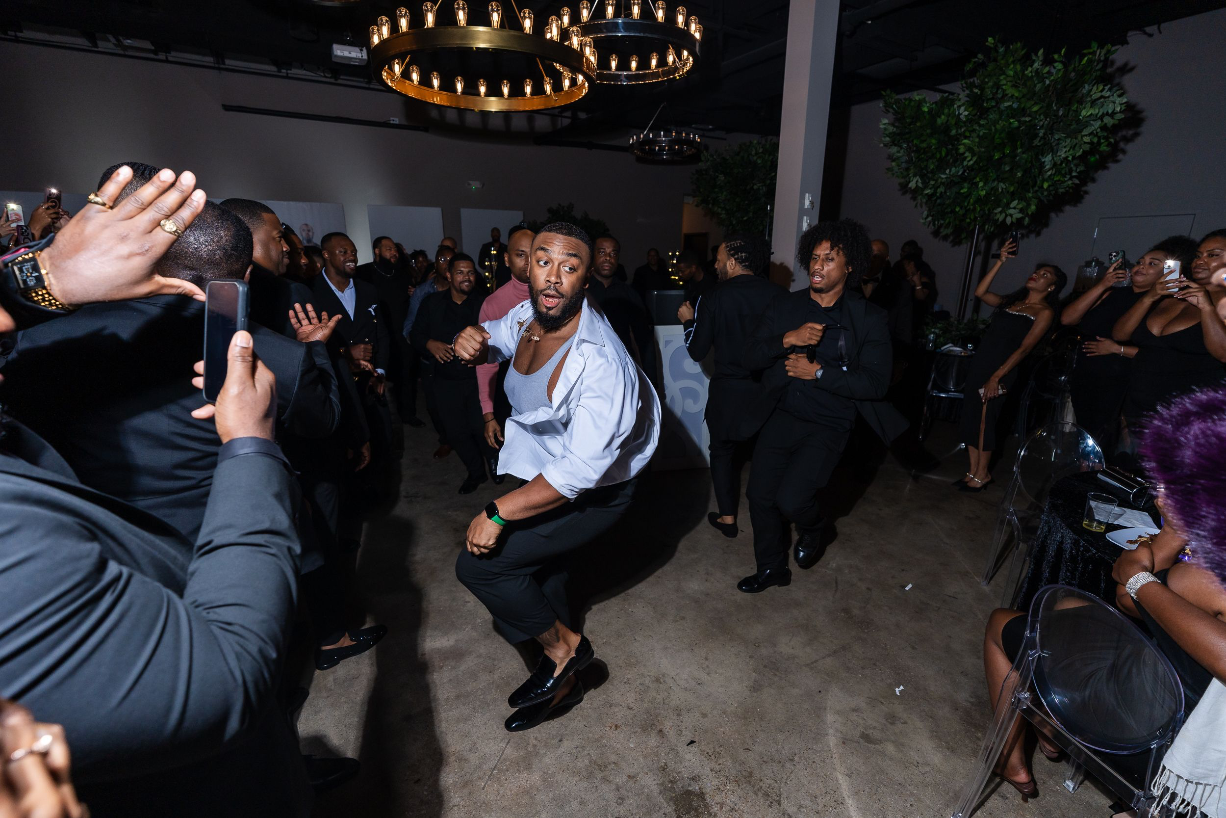 Guests dancing beneath the venue chandeliers at a Maryland celebration