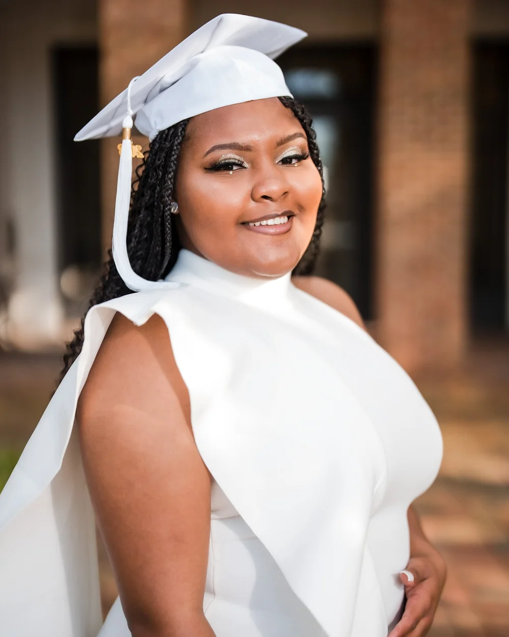 Close senior portrait in a white top