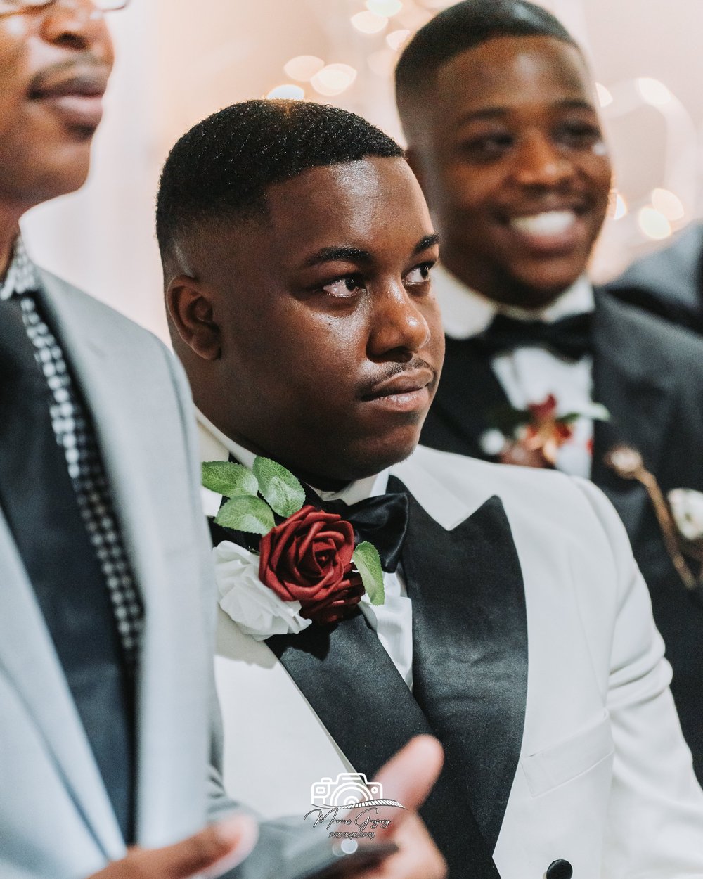 Groom in a burgundy jacket with his bride at a Baltimore wedding