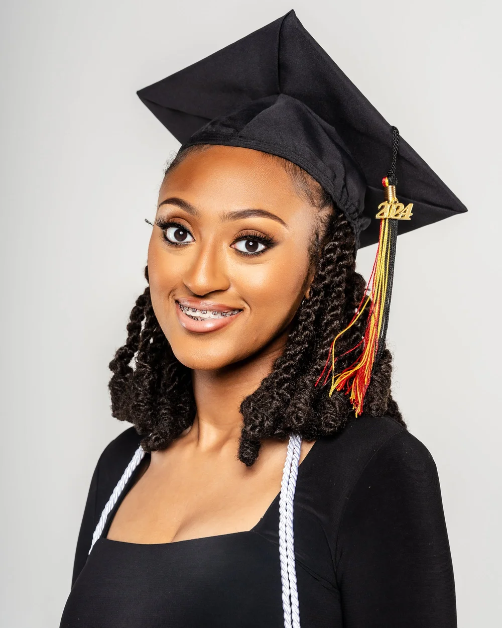 Graduate in cap with gold tassels