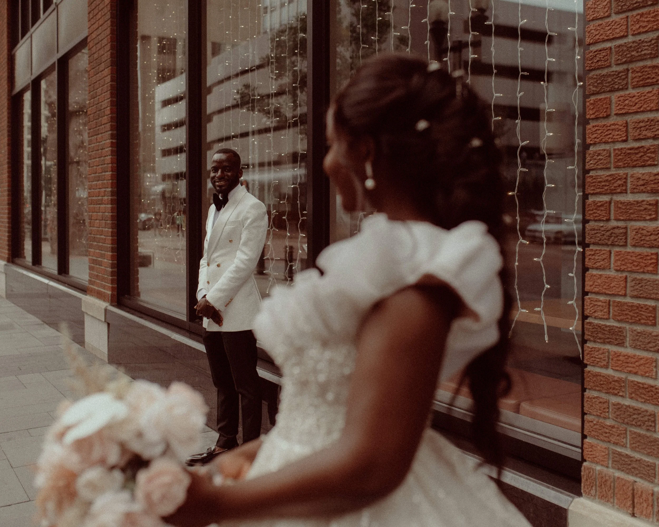 Bride and groom during a first look at an urban Edmonton wedding, downtown wedding photographer