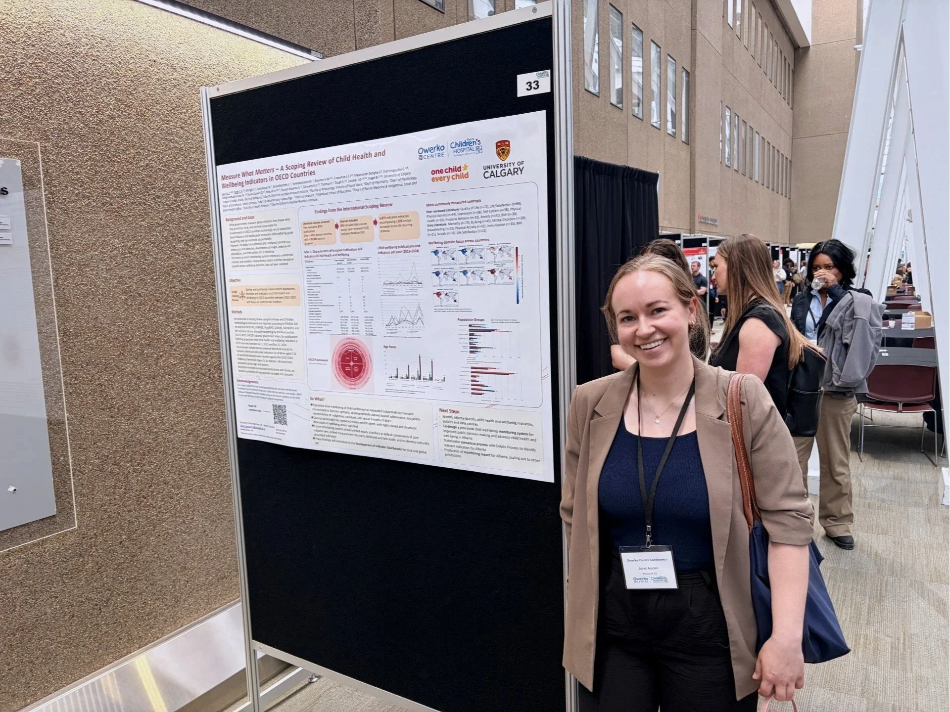 Janet during her poster presentation at the Owerko Centre Conference