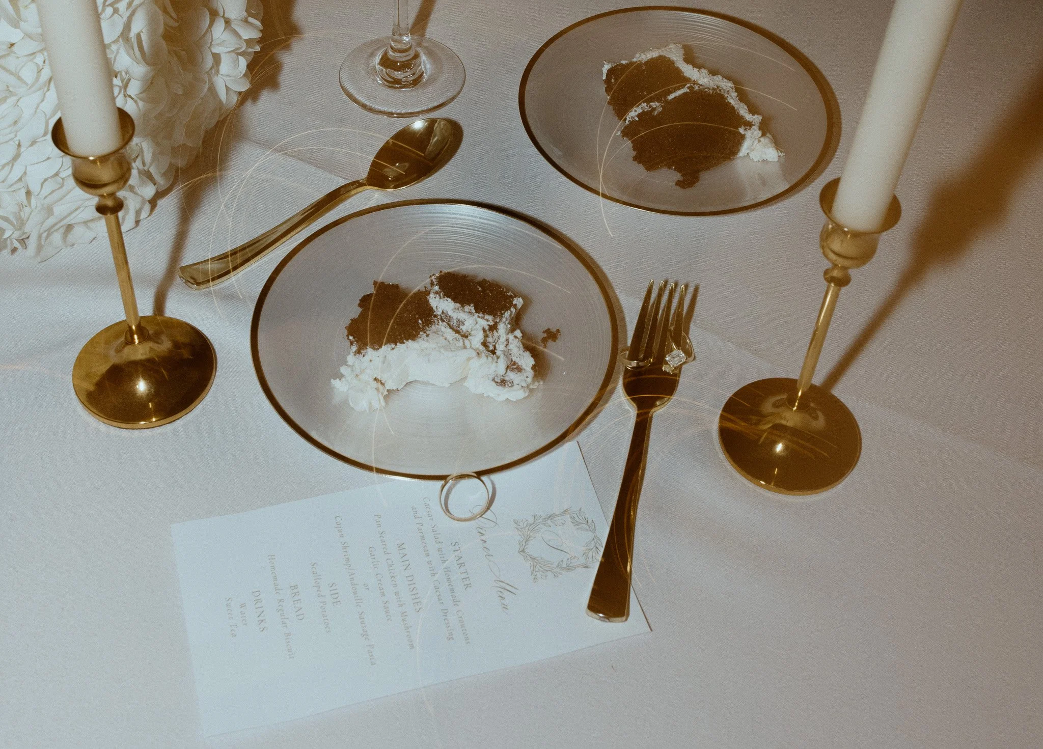 Wedding reception table with cake and candlelight photographed by an Essex wedding photographer