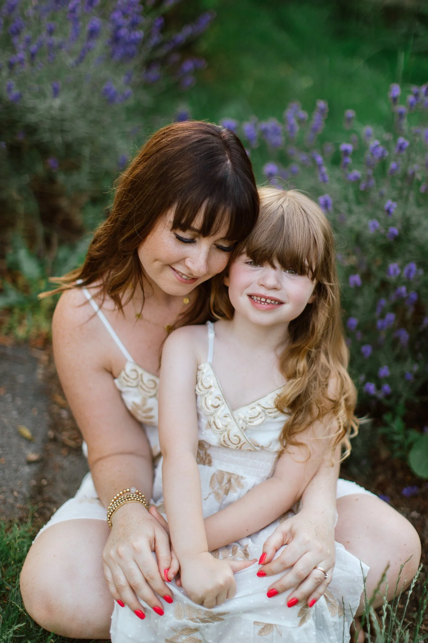 Mother and daughter embracing during an outdoor family portrait session in Essex