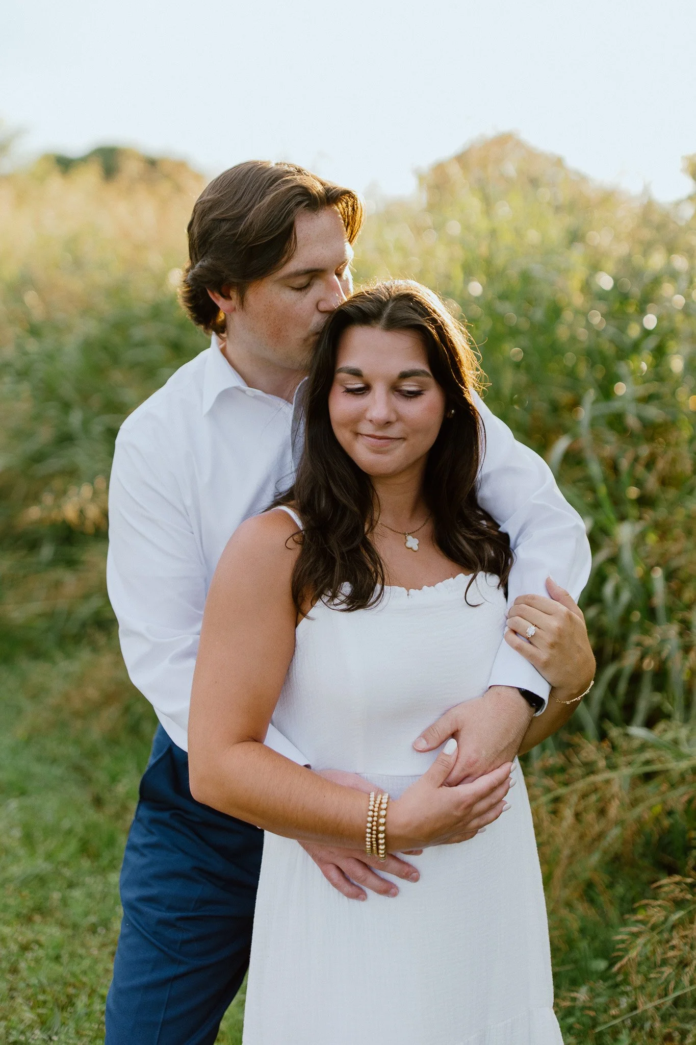 Couple embracing during a golden-hour outdoor portrait session