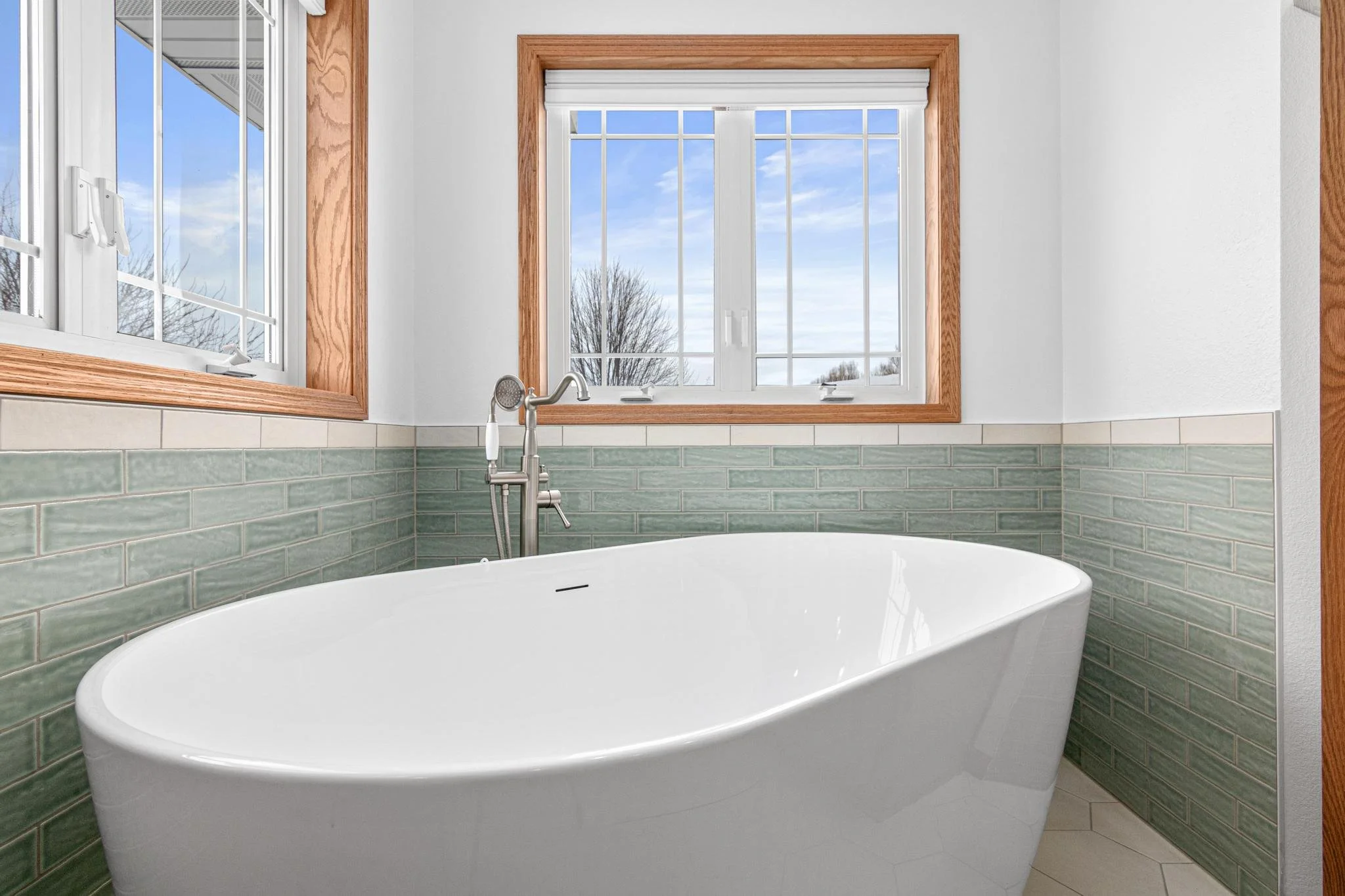 Master bathroom remodel white hex tile freestanding tub