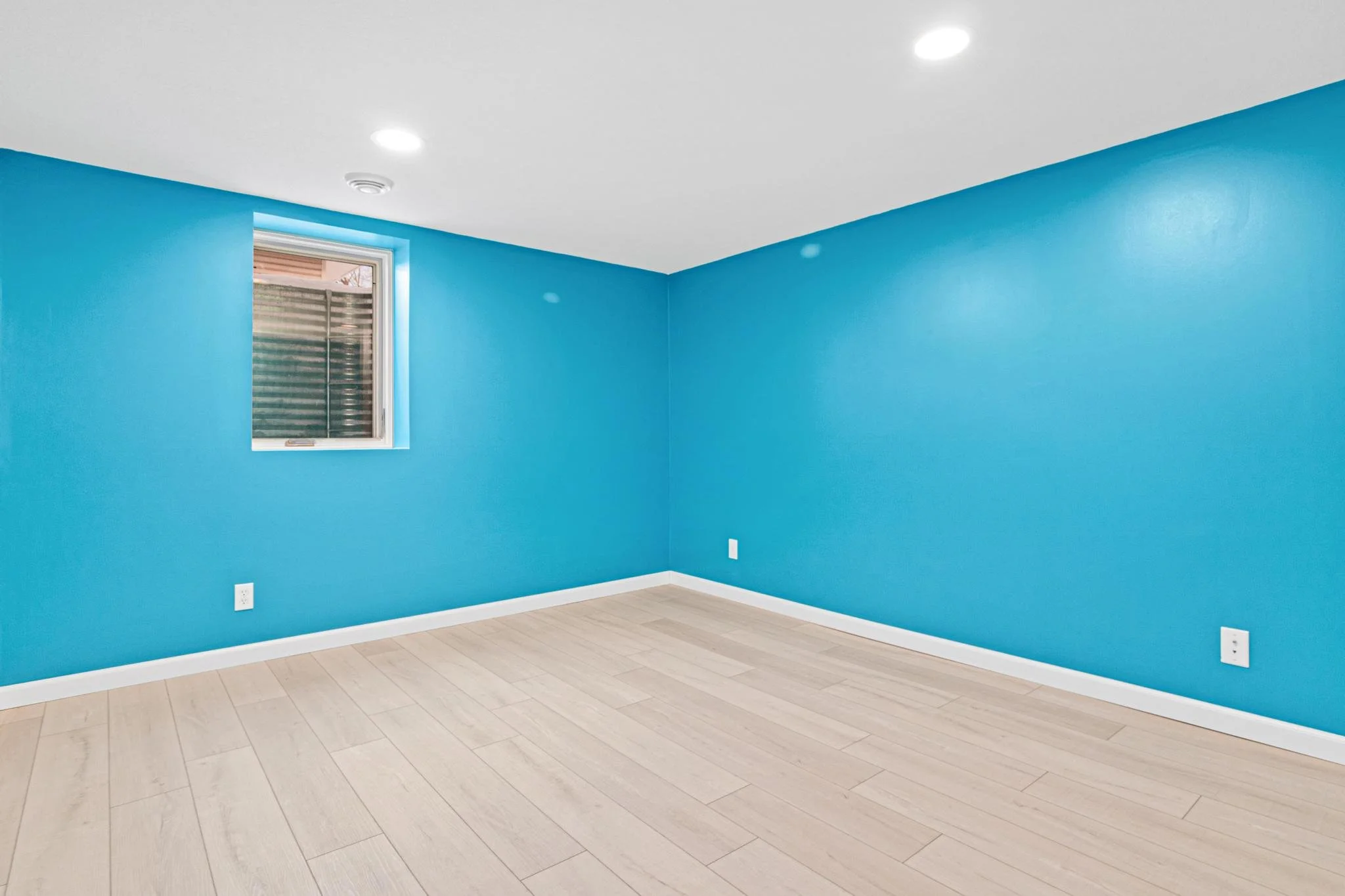 1955 Basement Finish in Coon Rapids, MN LVP White Trim Egress Window Recessed Lights Sherwin Williams Paint
