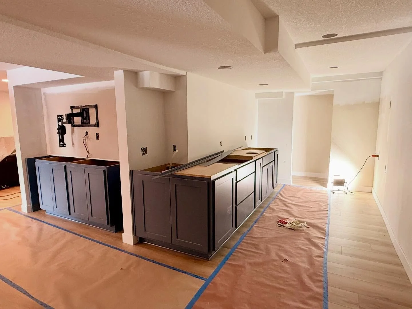 Things are starting to come together at the Nautical Basement Remodel 😍 Flooring is in. Cabinets are in. Trim and doors just got installed today!
