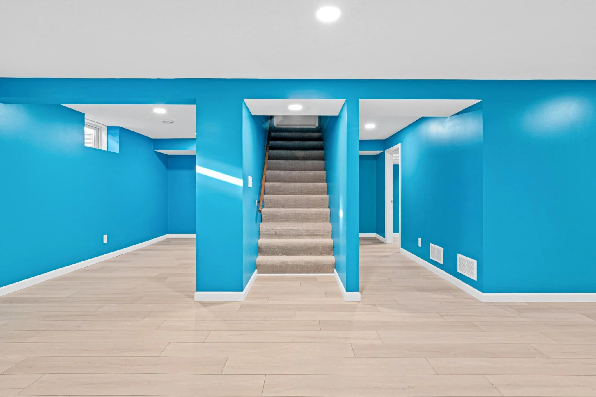 1955 Basement Finish in Coon Rapids, MN LVP White Trim Egress Window Recessed Lights Sherwin Williams Paint