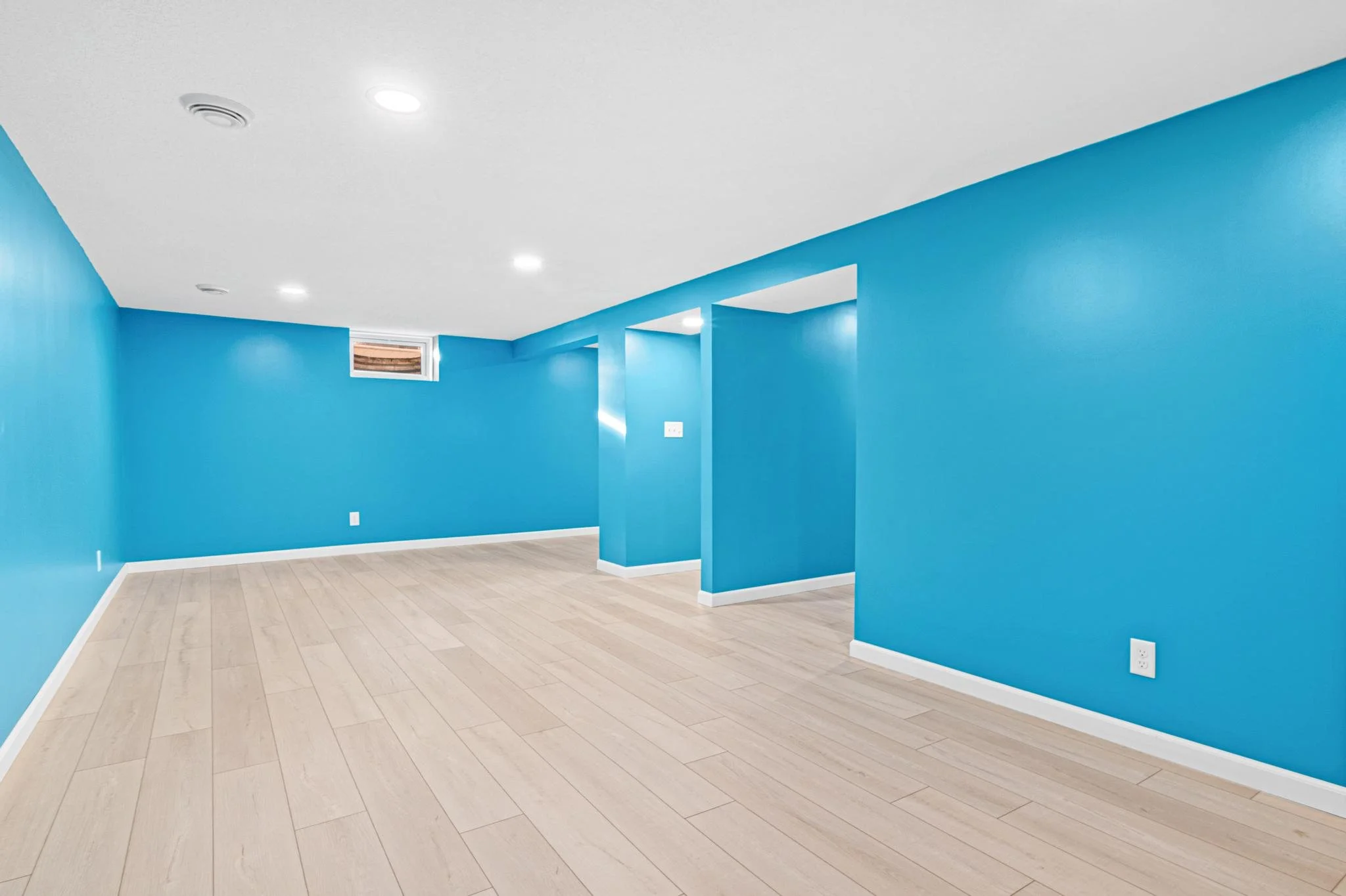 1955 Basement Finish in Coon Rapids, MN LVP White Trim Egress Window Recessed Lights Sherwin Williams Paint