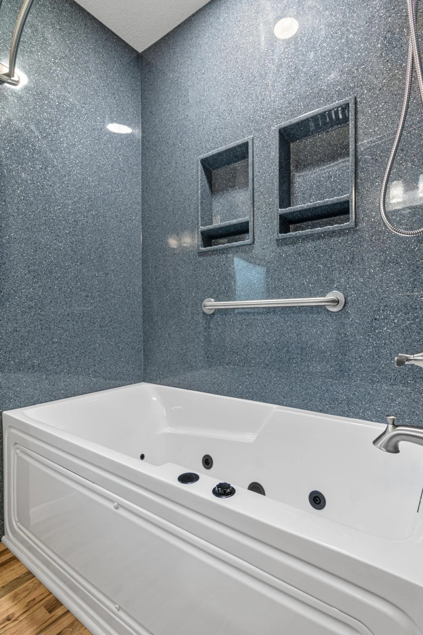 Bathroom remodel using onyx shower panels and onyx vanity top and sink with custom vanity and toilet cabinet and lvp flooring