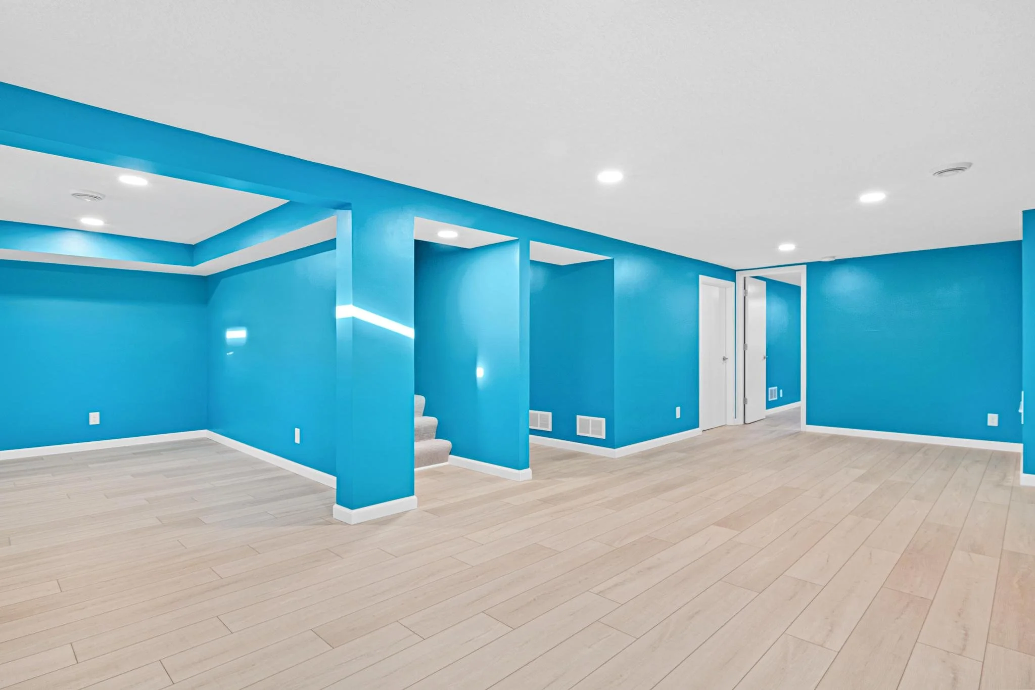 1955 Basement Finish in Coon Rapids, MN LVP White Trim Egress Window Recessed Lights Sherwin Williams Paint