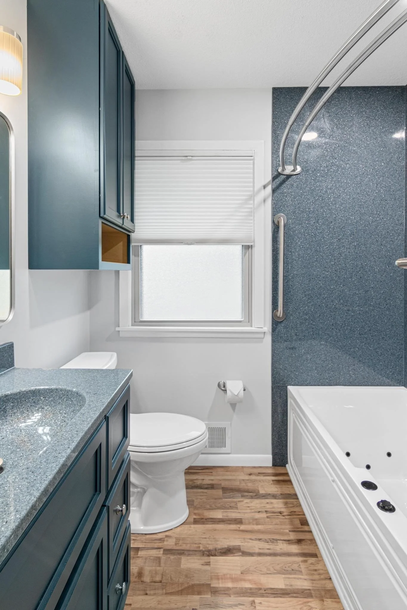 Bathroom remodel using onyx shower panels and onyx vanity top and sink with custom vanity and toilet cabinet and lvp flooring