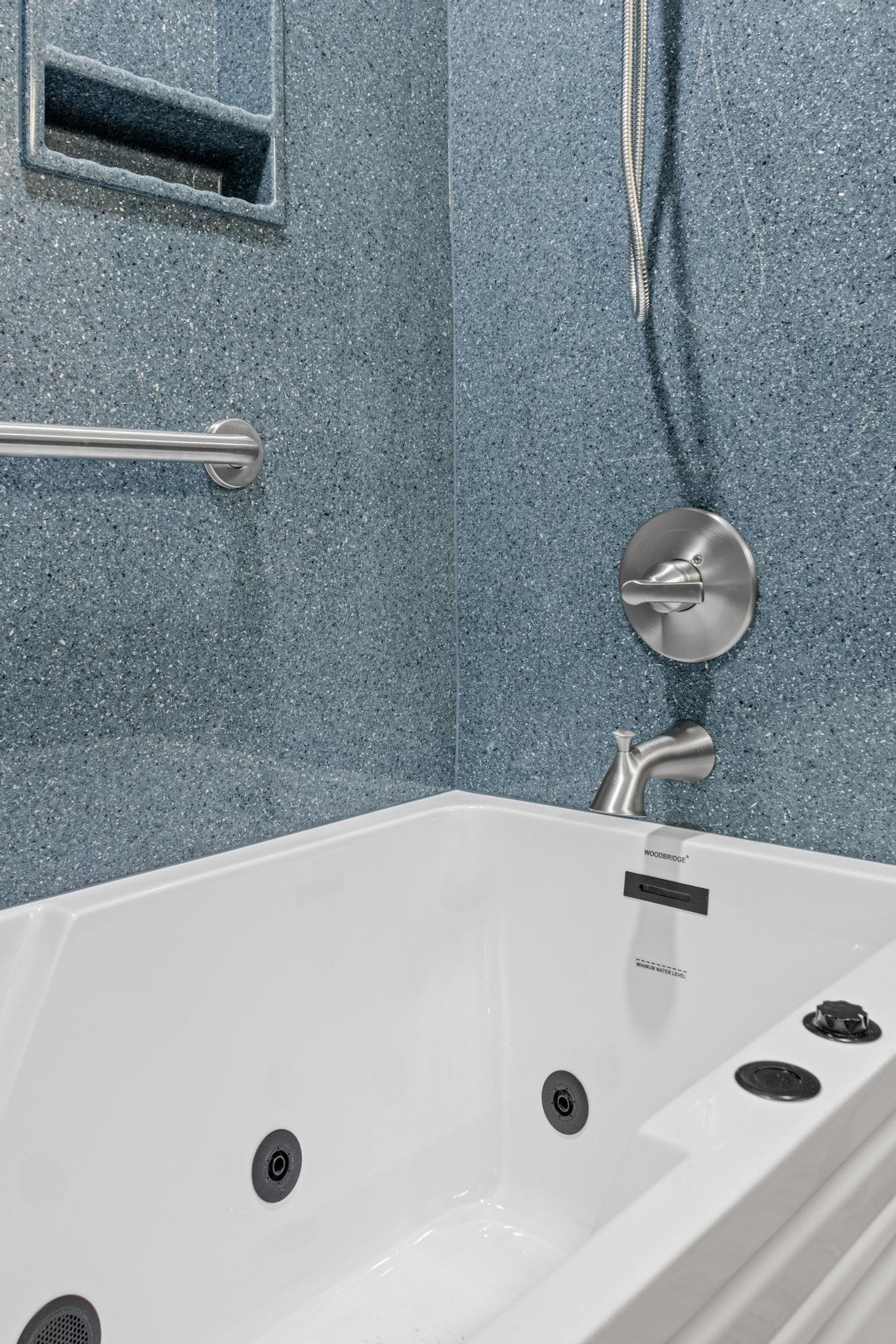 Bathroom remodel using onyx shower panels and onyx vanity top and sink with custom vanity and toilet cabinet and lvp flooring