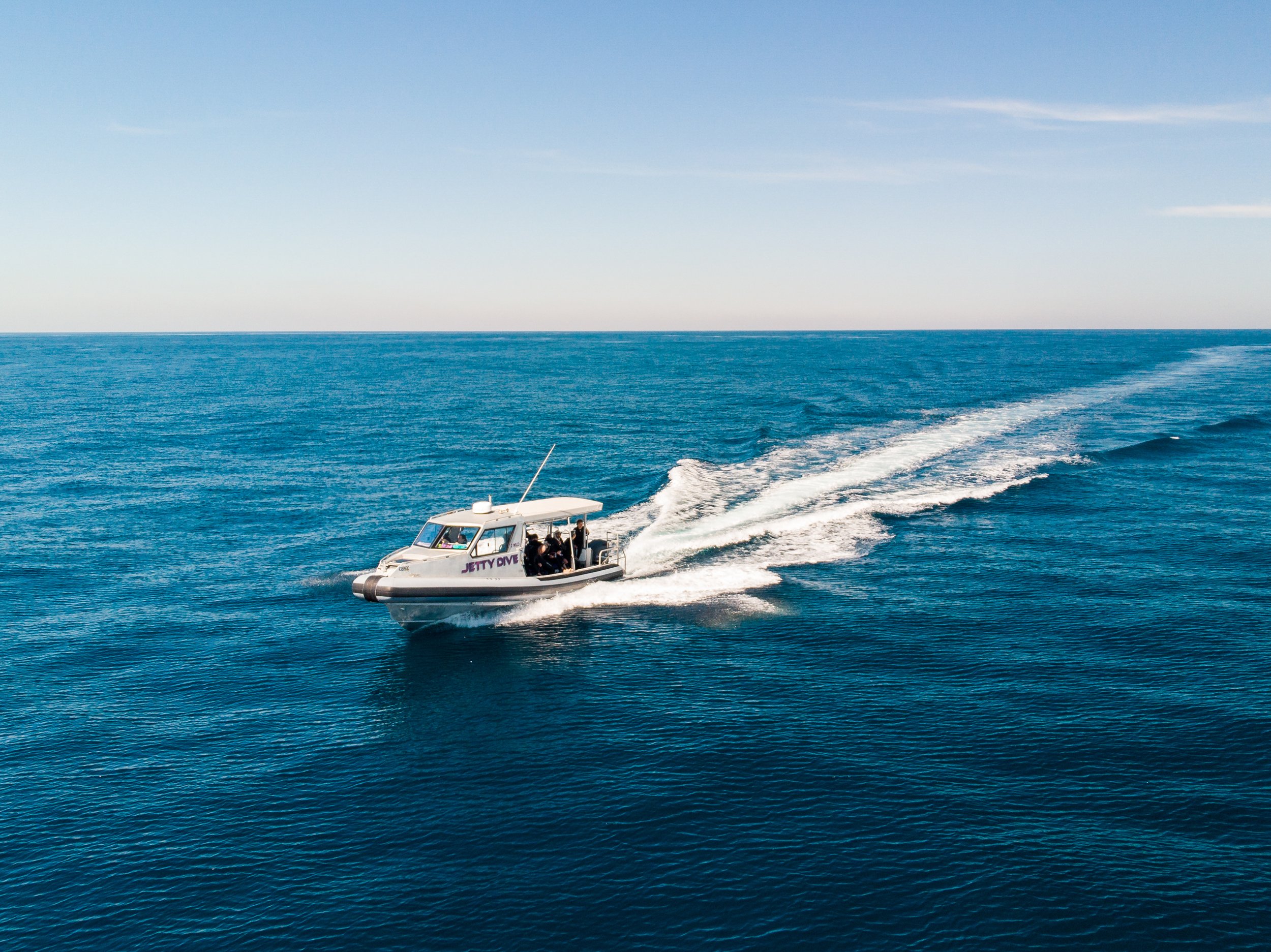 Aerial drone image taken of dive boat on glassy morning. Image taken by our team of in house photographers.