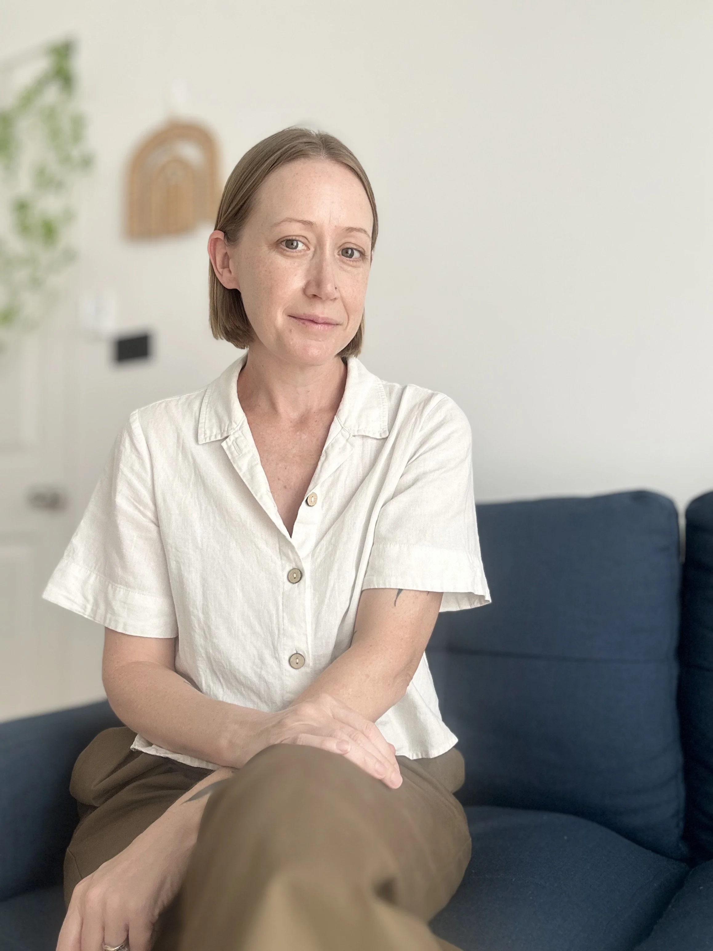 Rach Wheatley sitting on a couch