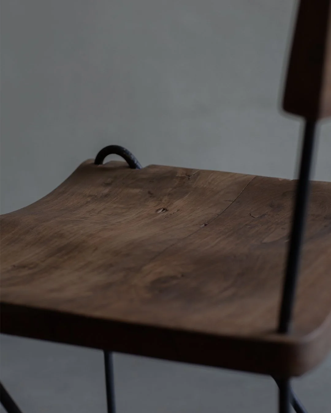 Pierre Jeanneret Chair PJ-SI-06-A: A timeless masterpiece by Pierre Jeanneret, crafted with teak and iron, showcasing sleek design and exceptional craftsmanship. Displayed at the Museum Chandigarh