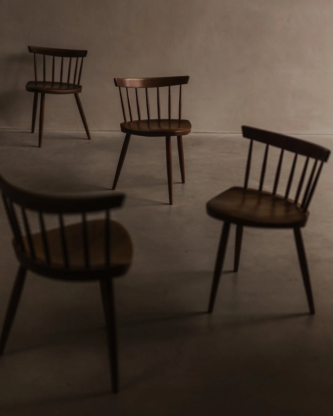 Set of four wooden Mira Chairs designed by George Nakashima and made by Walter Downs, 1956–1957, in walnut and poplar