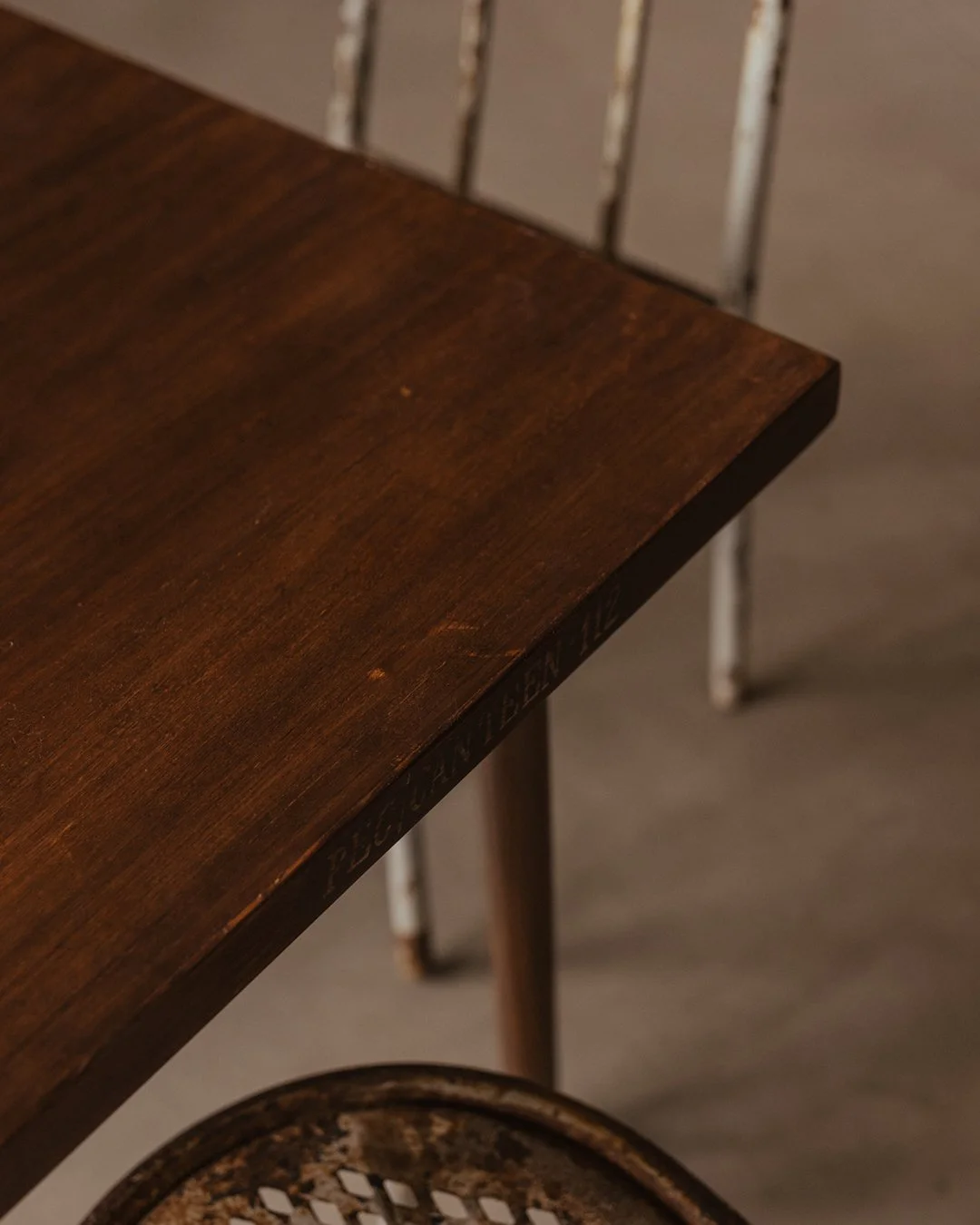 Pierre Jeanneret PJ‑TA‑04‑A square cafeteria/dining table, solid teak with brown lacquered veneer, thick square top, tapered vertical legs, mid-century Chandigarh design, circa 1955, restored