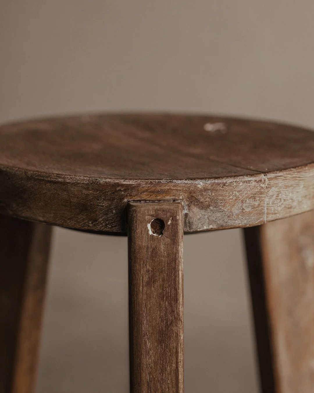 Vintage PJ-SI-22-A stool by Pierre Jeanneret, circa 1965-66 solid teak construction circular iron crossbar with gray-blue lacquer P.U. Scientific Block collection in Chandigarh, India.