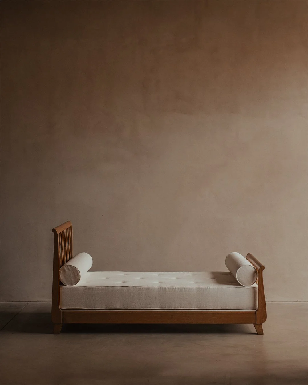 "lit croissilion" or "lit simple" oak daybed from Oran, Algeria, with croissilion headboards attributed to Jean Royère