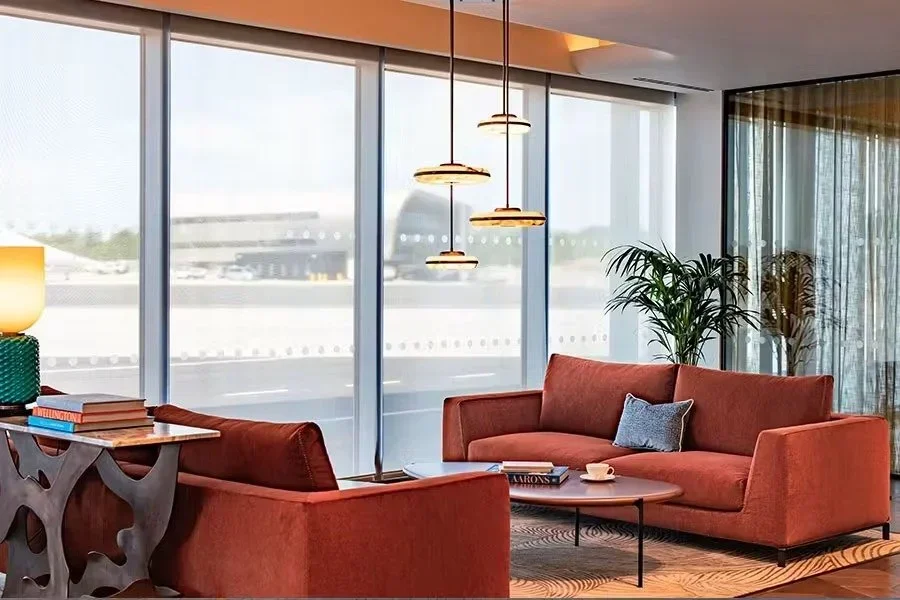 Sofas and runway views in the Flexjet lounge at Farnborough Airport