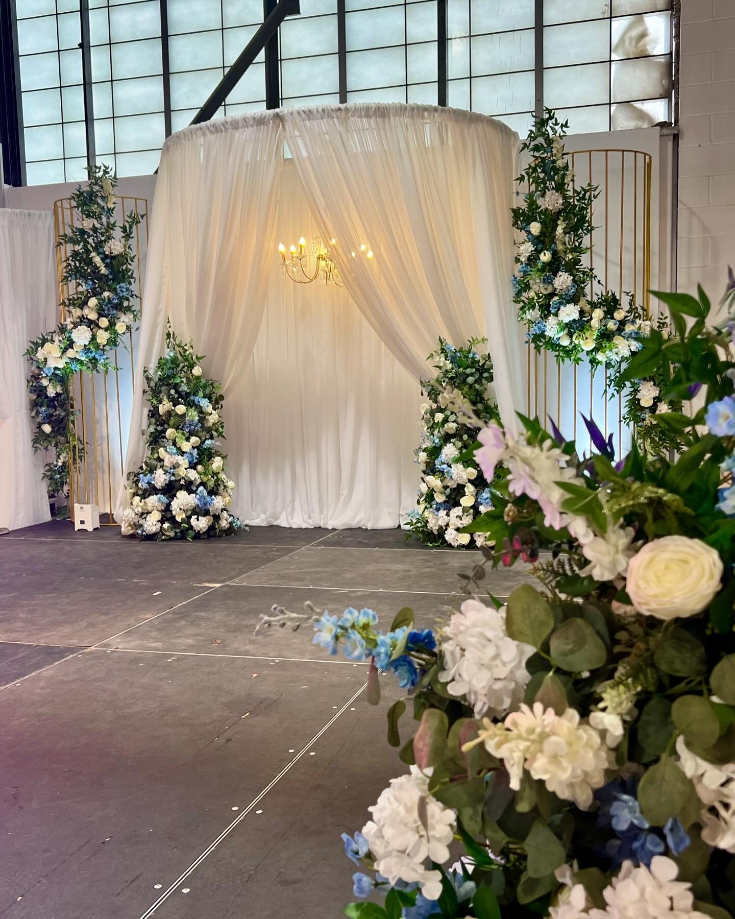 🤍🩵 Our dreamy stage Design 🩵🤍
Thanks to our friendors @truenorthevents.hfx for bringing it to life with the lighting &amp; music it deserved! 
.
.
Design, Lux Faux Floral &amp; Decor: @onedayaffair 
Tech Team: @truenorthevents.hfx 
Stage: @elemen