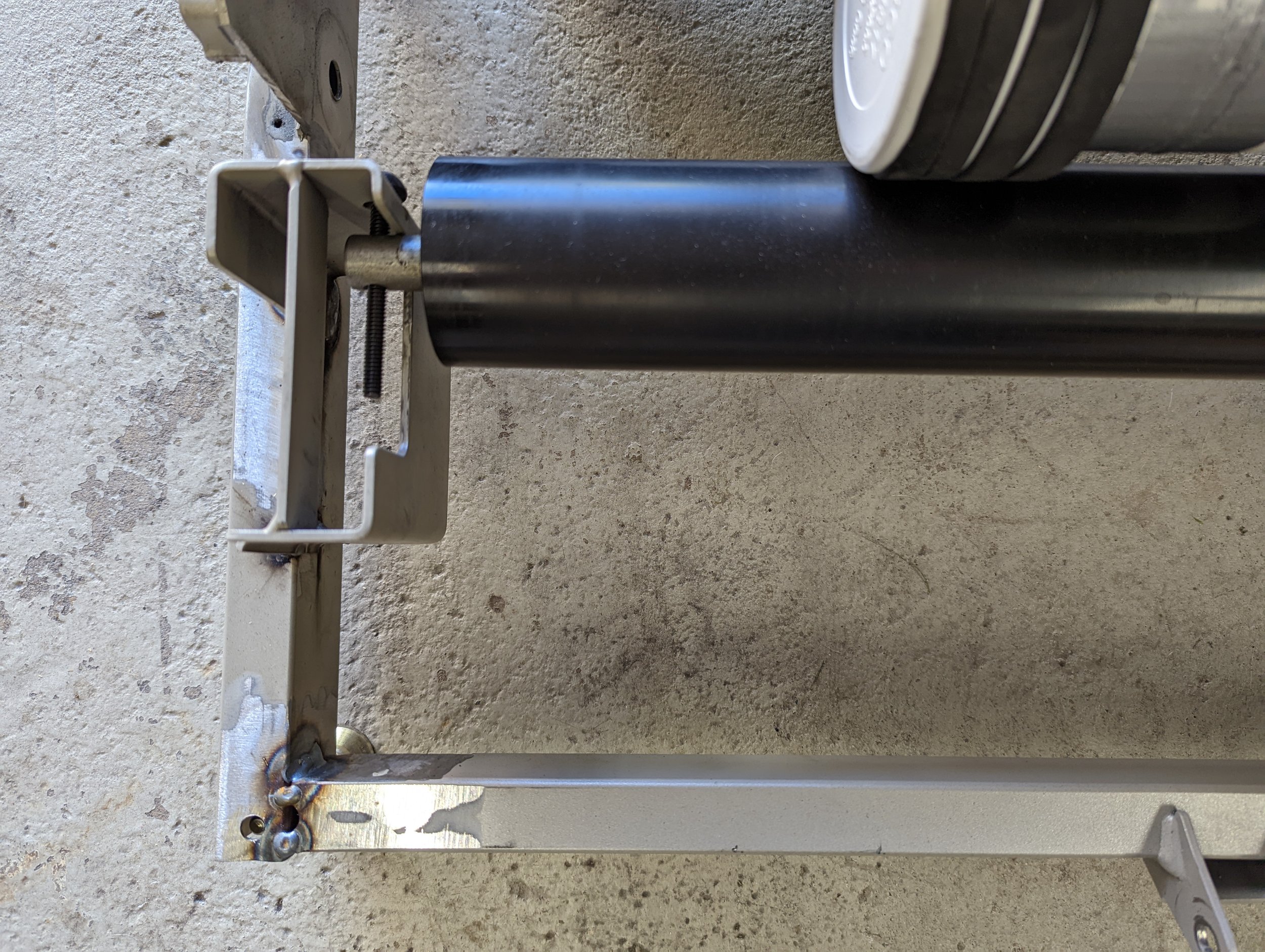 Treadmill frame modified to support the rock tumbler rollers.