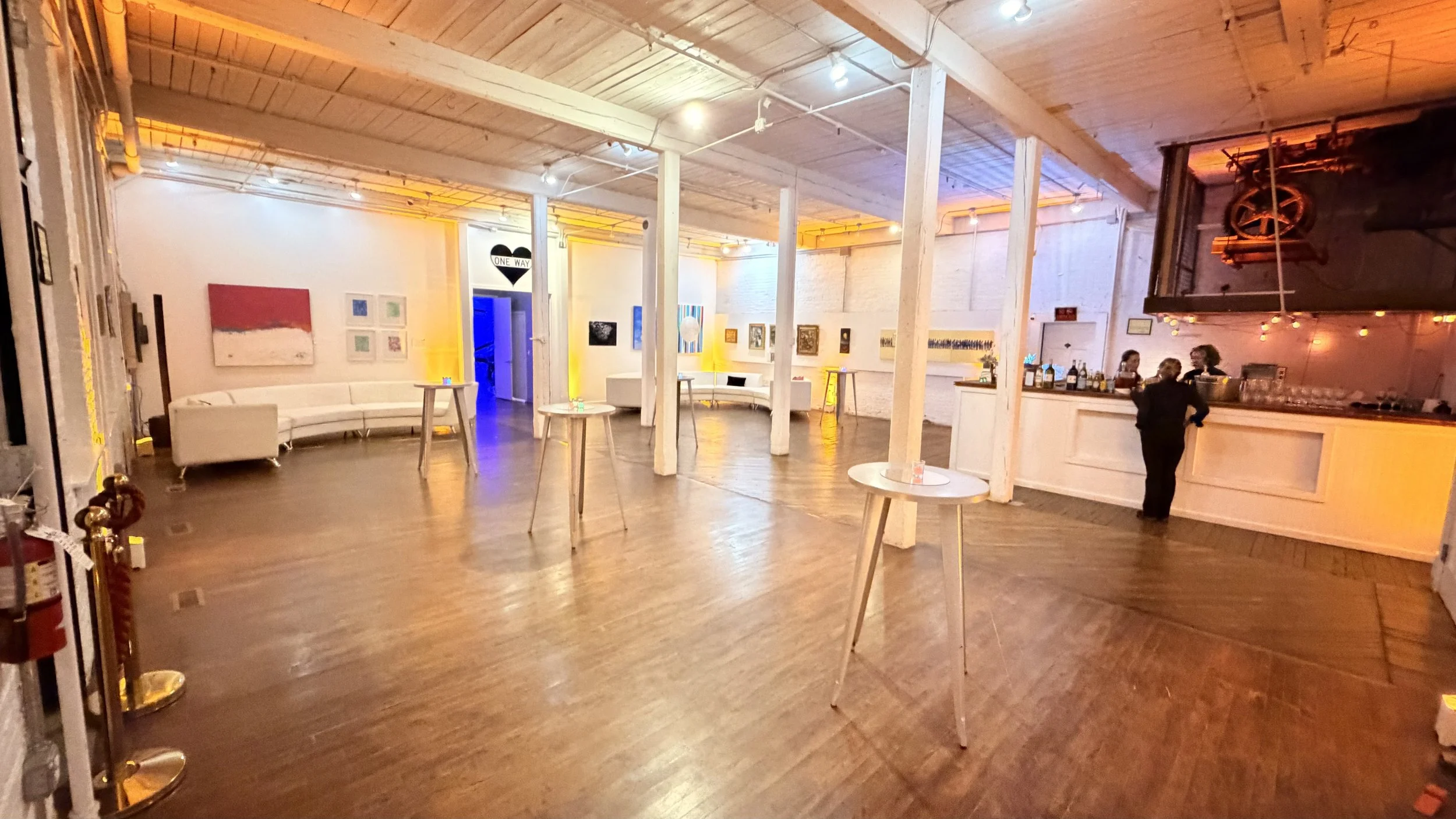 Armstrong Gallery event space at The Knowlton with open floor plan, gallery walls, cocktail tables, and built-in bar for receptions and corporate gatherings in Bridgeport, Connecticut.