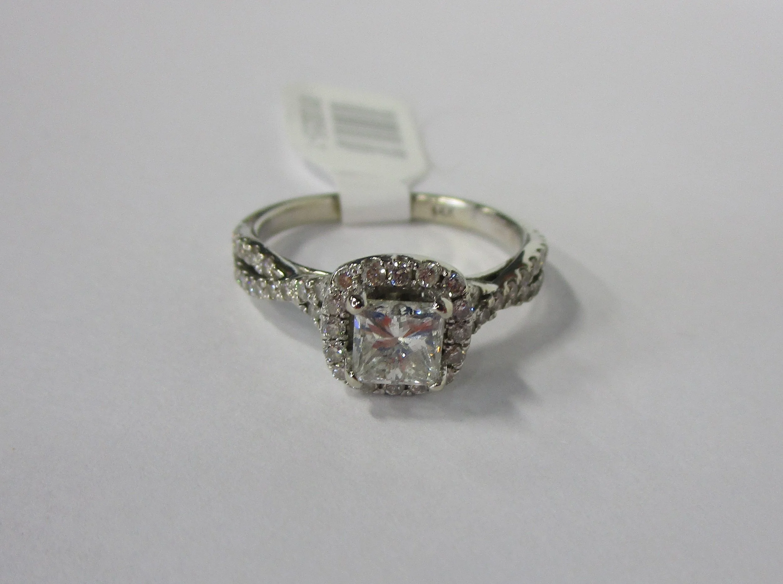 Ring 14kt White Gold 4.3 GR .65ct Princess Cut Ctr Approx. .60cttw Melee Diamonds 1.25cttw.