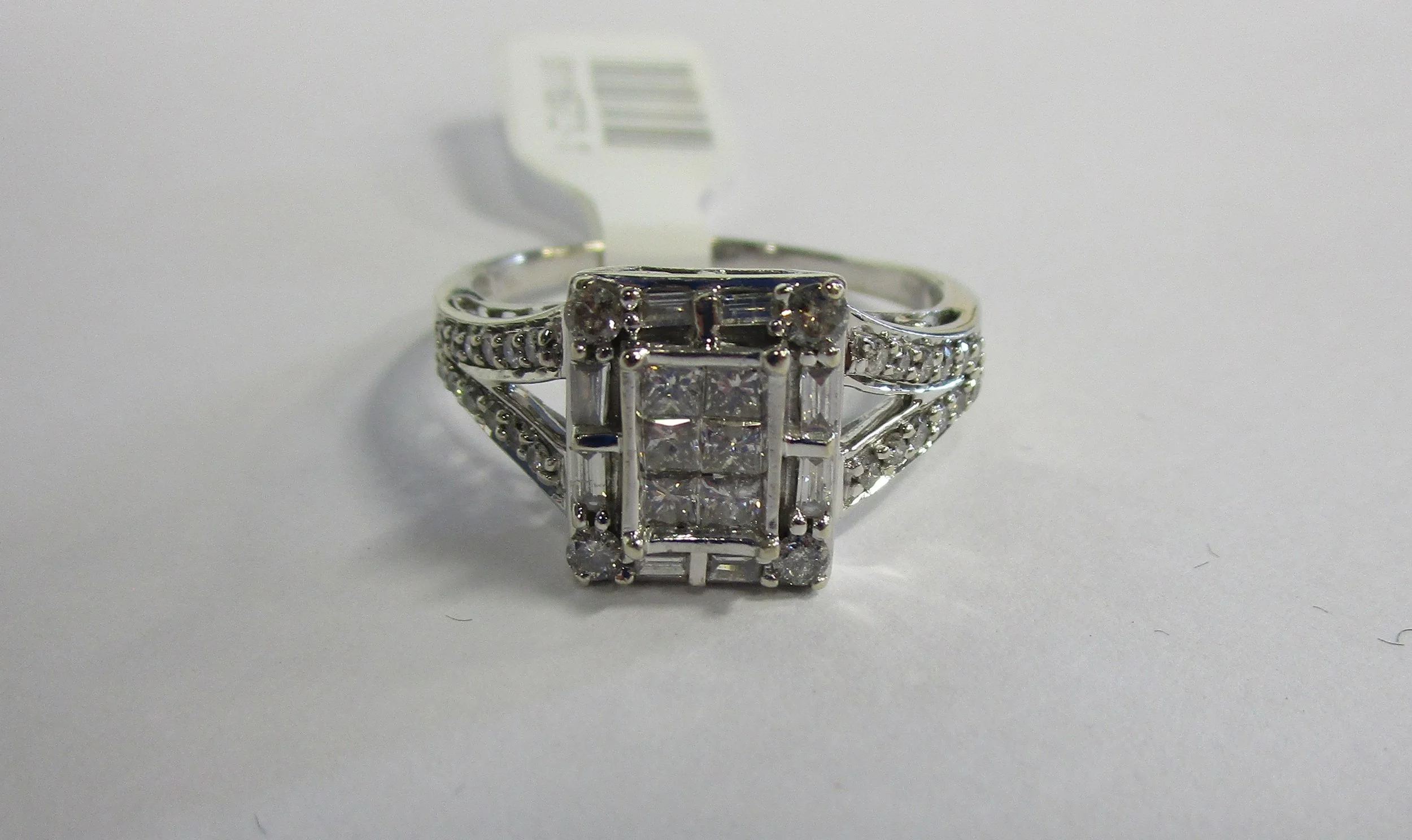 Ring 10kt White Gold SIZE:11 4.9 GR .30cttw Invisible Set Ctr approx. .75cttw.