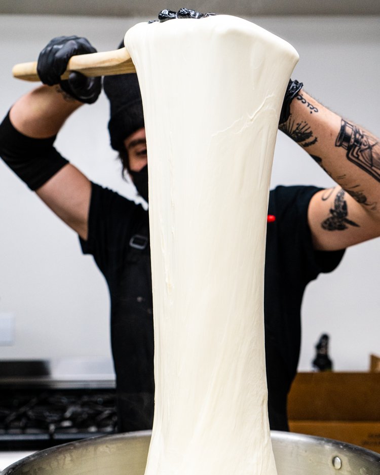  We make our mozzarella daily by hand - including stretching and shaping.  