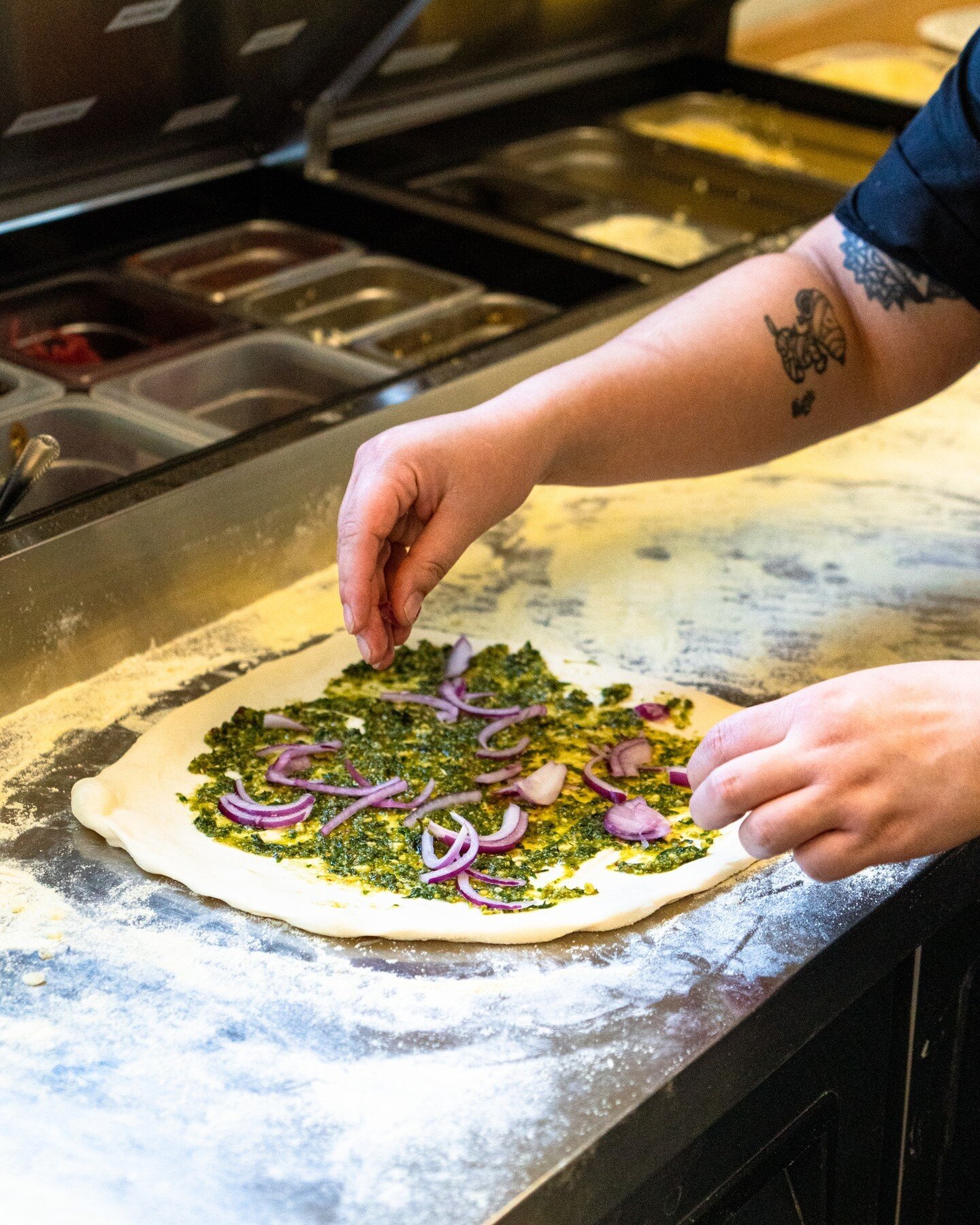 Handcrafted Basil Pesto Chicken pizza in the making! #yum⁠
⁠
It's Hot, Hot, Hot! 🥵 Our AC is running full blast for anyone that needs an escape from this heatwave. The taproom is open today from noon til midnight serving up cold beers. ⁠
⁠
🍺 Don't 