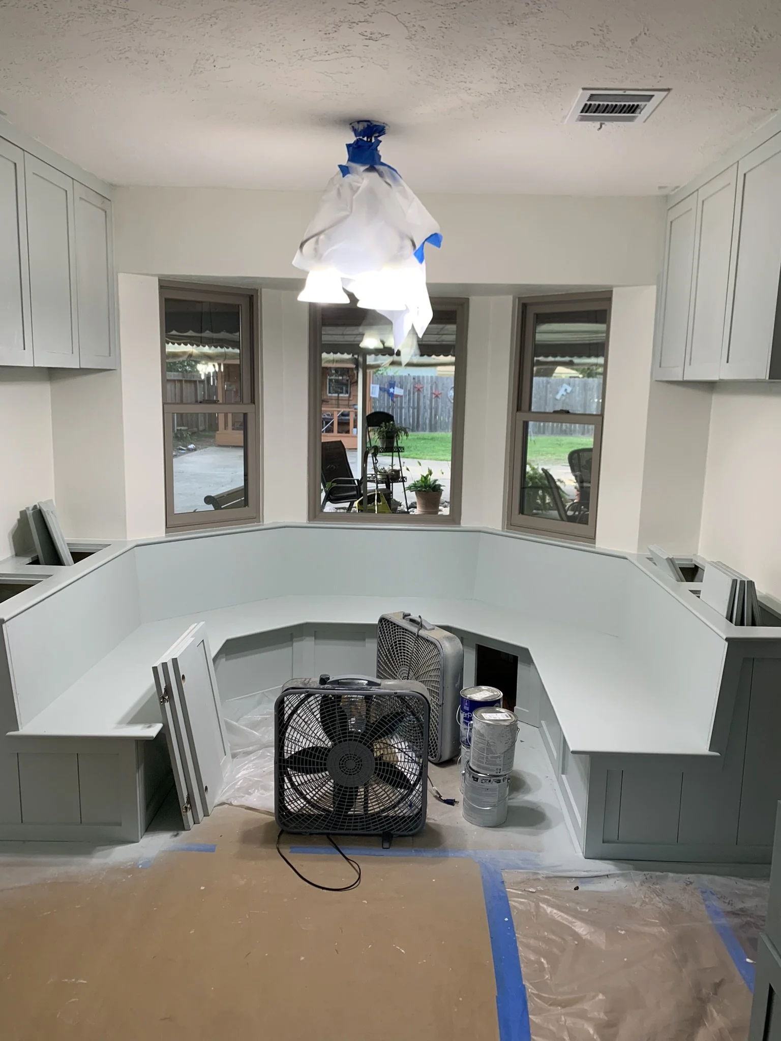 Bay window bench with cabinets