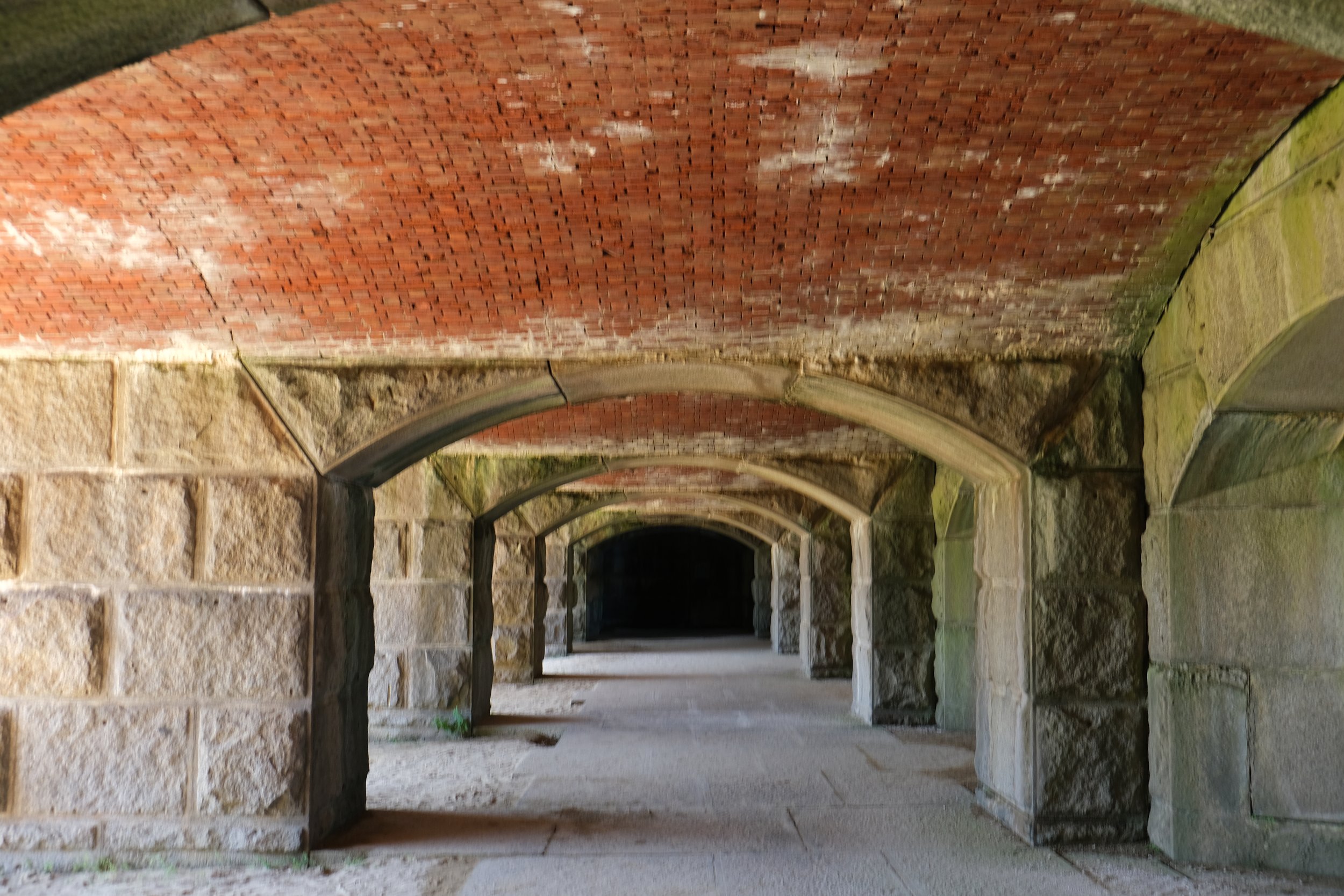   Under the fort’s granite and brick arches.  