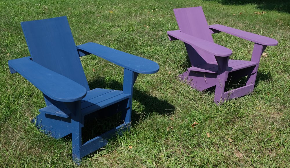   An interesting version of wide-armed Adirondack chairs.  