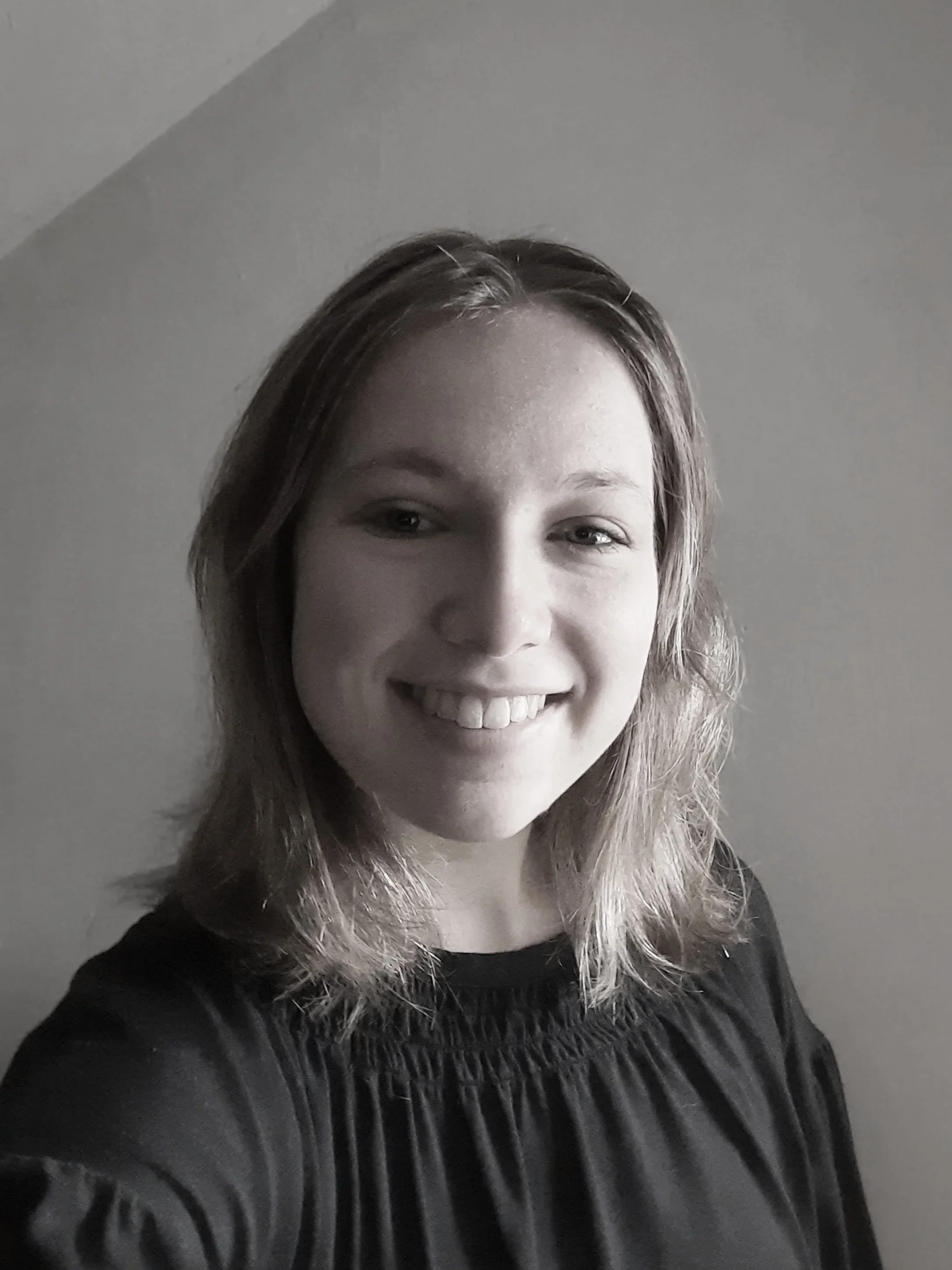 A dancer smiles at the camera.